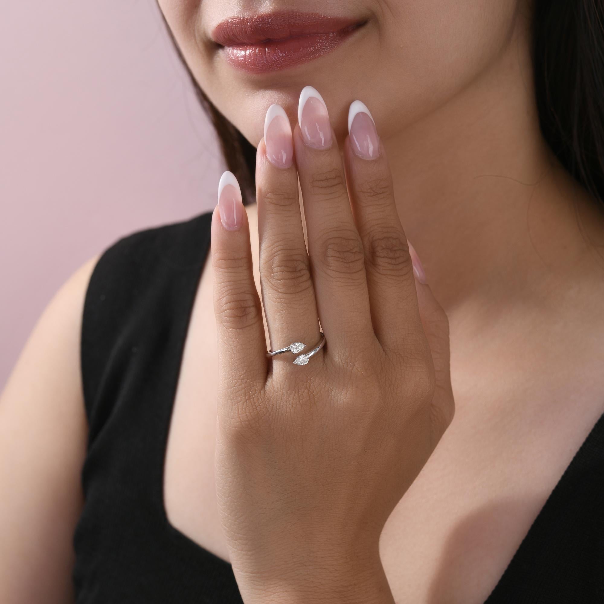 Minimalist Pear Certified Diamond Open Cuff Bypass Ring 18K White Gold Jewelry
This ring features two dazzling pear-shaped diamonds positioned on an open band, creating a chic and contemporary wrap-around look. The fluid design hugs the finger