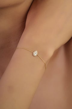 Minimalistisches Diamant Halo Solitär Kettenarmband mit Birnenschliff aus 14K Gelbgold