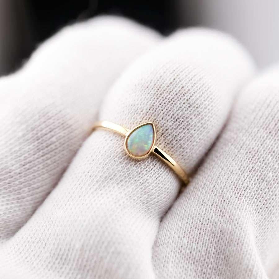 Minimalist Pear Shaped Natural Australian Solid Opal Ring 14k Yellow Gold.


Free Domestic USPS First Class Shipping! Free Gift Bag or Box with every order!

Opal—the queen of gemstones, is one of the most beautiful gemstones in the world. Every