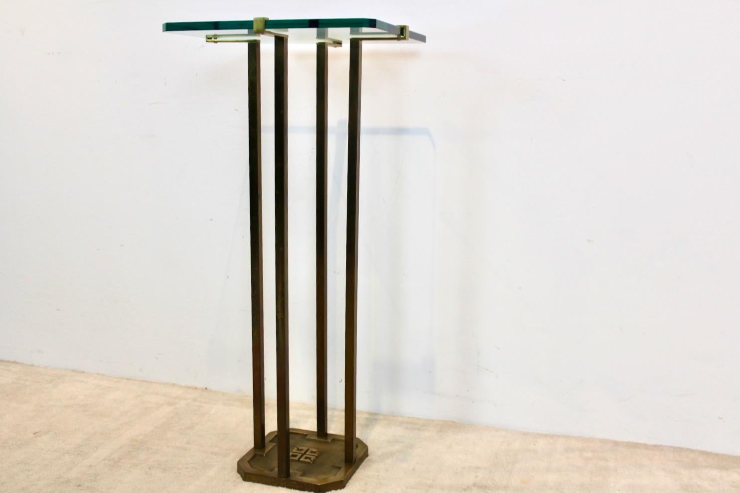 Wonderful and Minimalist Brass and Glass Pedestal Table designed by Peter Ghyczy in the early 1970s in the Netherlands. Born in Budapest, Peter Ghyczy started his career as an architect in Germany and has been living in the Netherlands for many