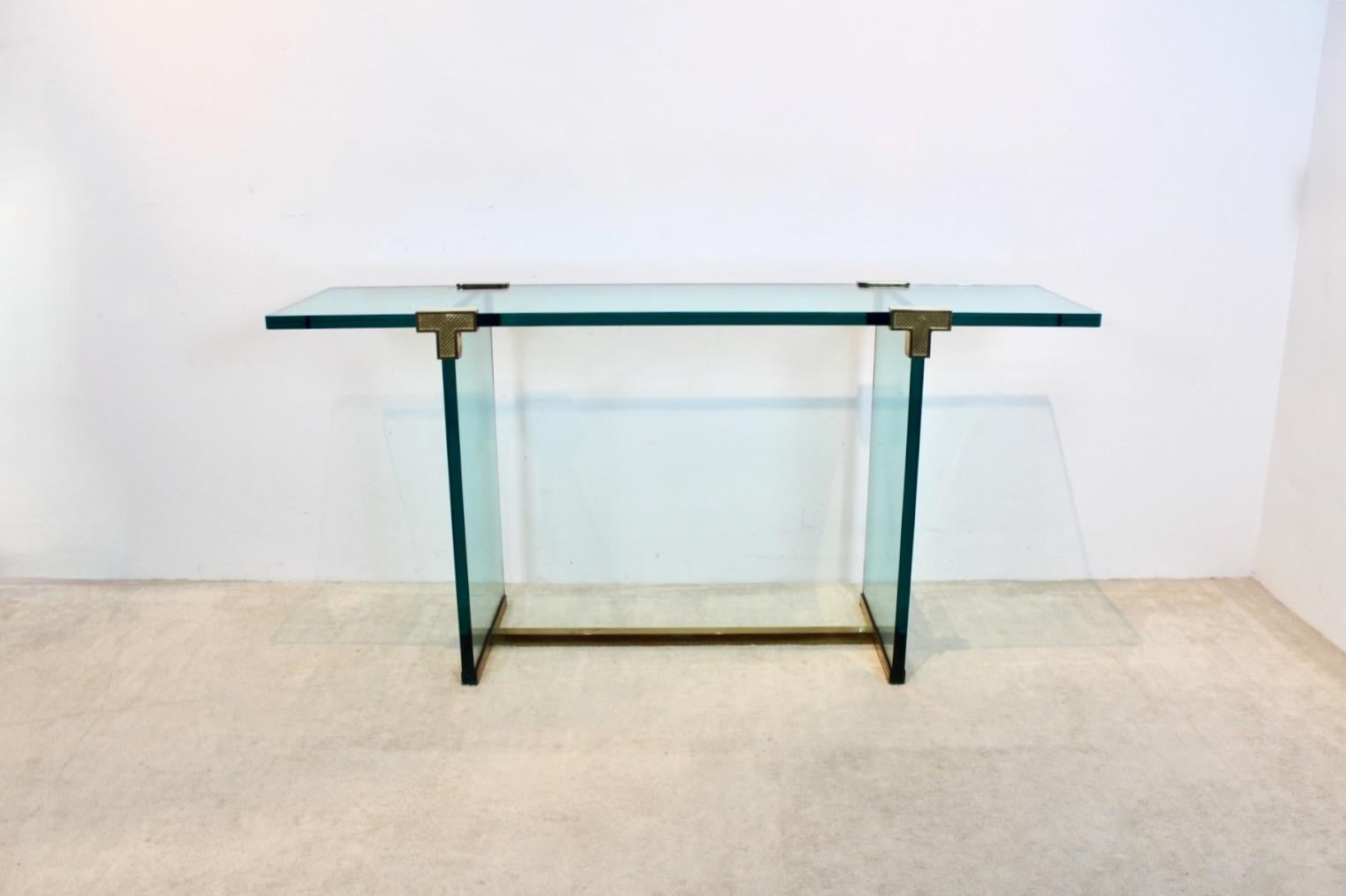 Wonderful and Minimalist Brass and Glass T30 Console table designed by Peter Ghyczy in the early 1970s in the Netherlands. Born in Budapest, Peter Ghyczy started his career as an architect in Germany and has been living in the Netherlands for many