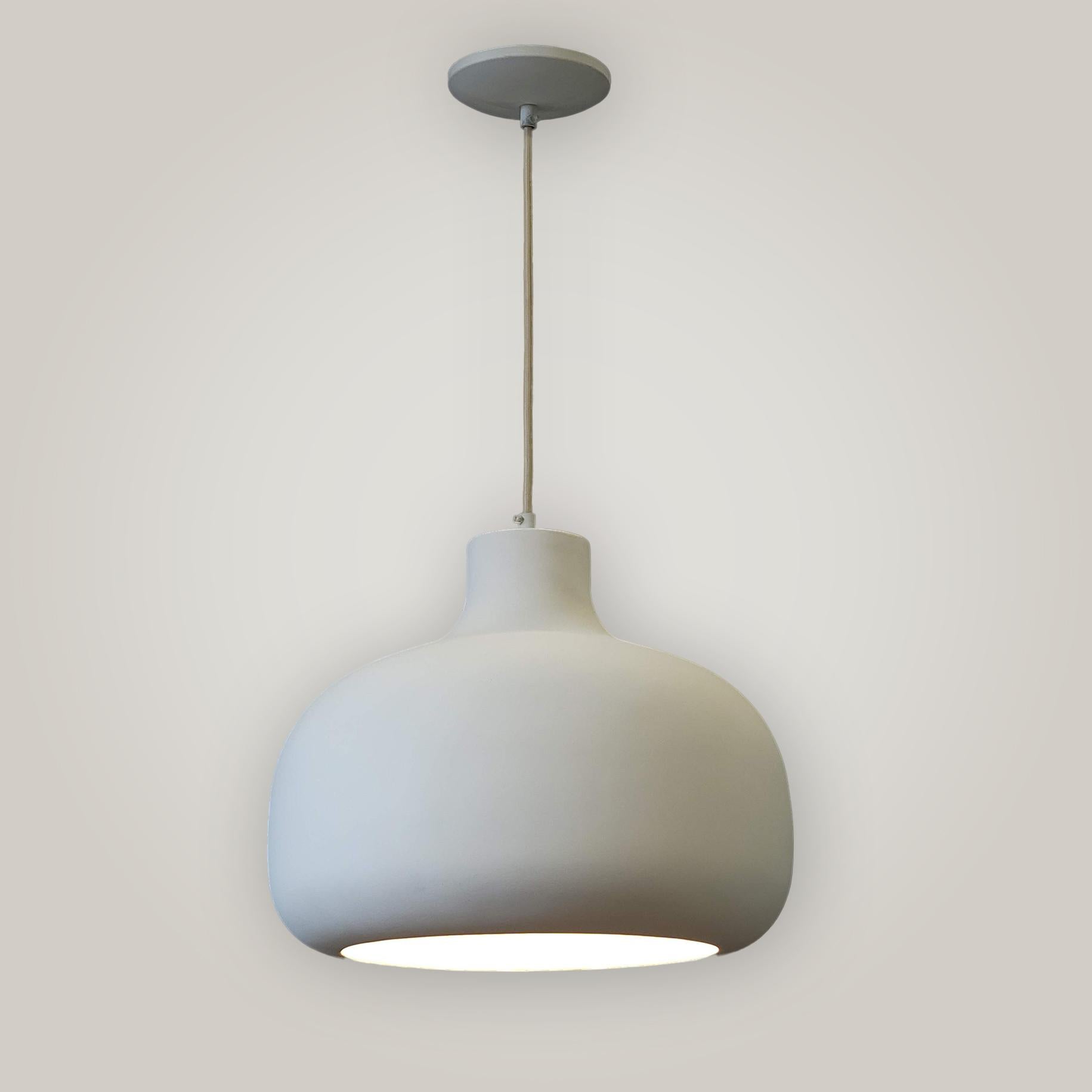 Crafted with care in New York, USA, our minimalist plaster pendant light fixture adds a touch of modern elegance to any room. This handcrafted piece is designed to blend seamlessly into your home decor. Suitable for dining areas, living rooms, or