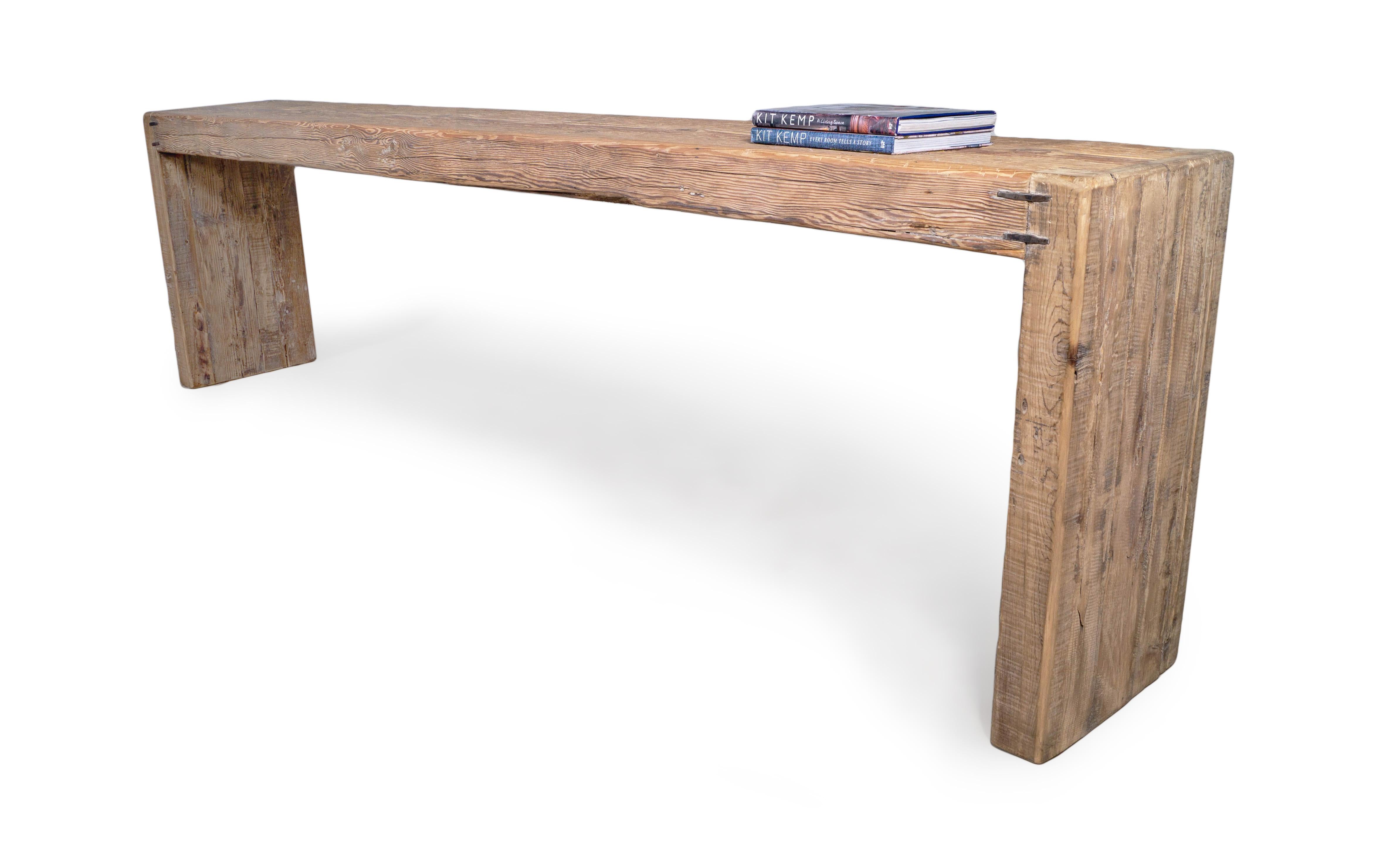 This minimalist provincial serving table in reclaimed elm features a beautiful waterfall design and an organic texture that adds stunning detail and texture to any space. Metal cleats have been added to join the wood, providing added strength and