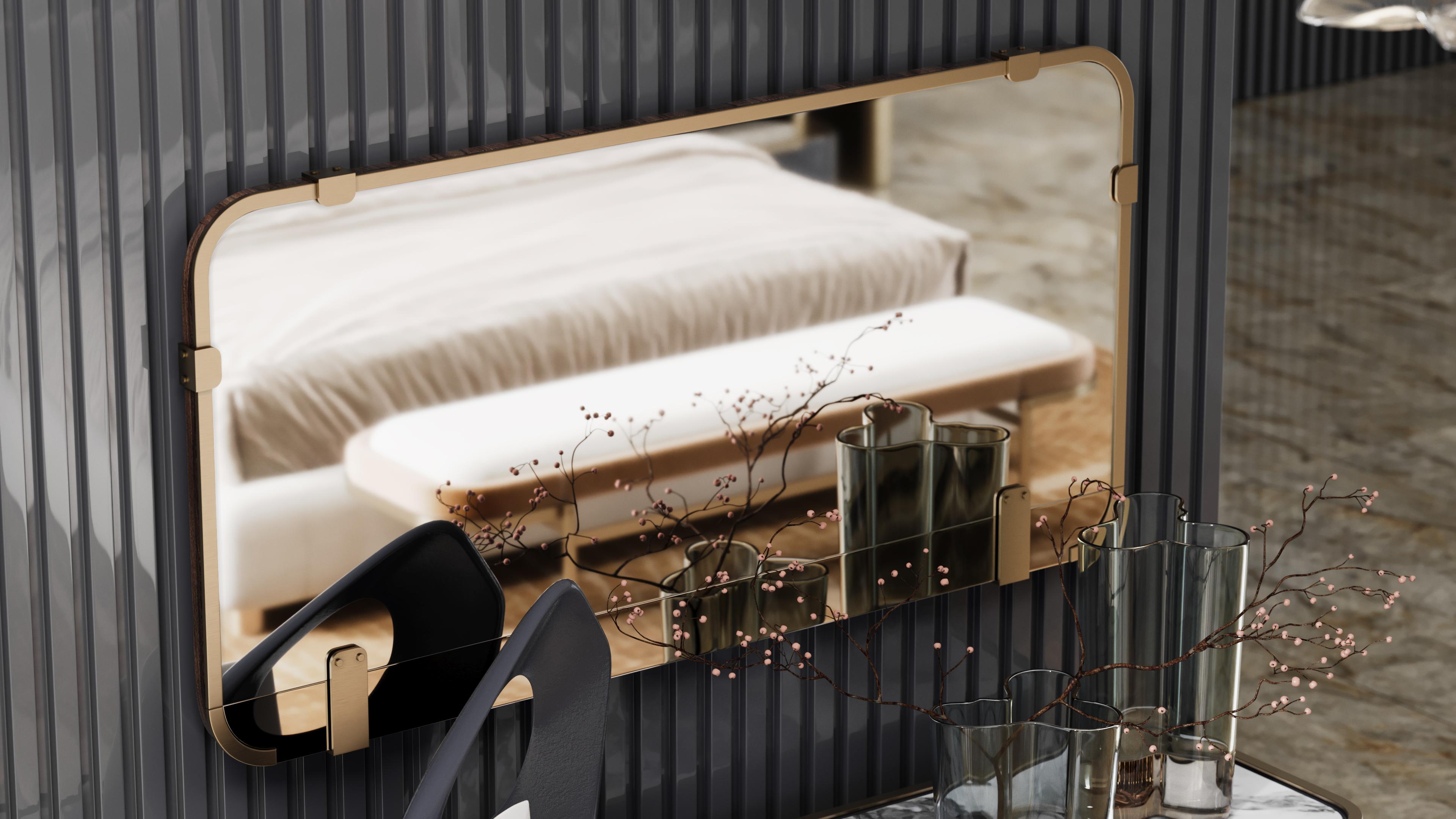 Lirak mirror combines elegance and simplicity, featuring a sleek frame with brushed brass accents. The design contrasts clear and bronze mirrors, creating a subtle yet striking visual effect.