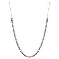 Collana tennis minimalista con zaffiro blu rotondo in oro giallo 14 carati