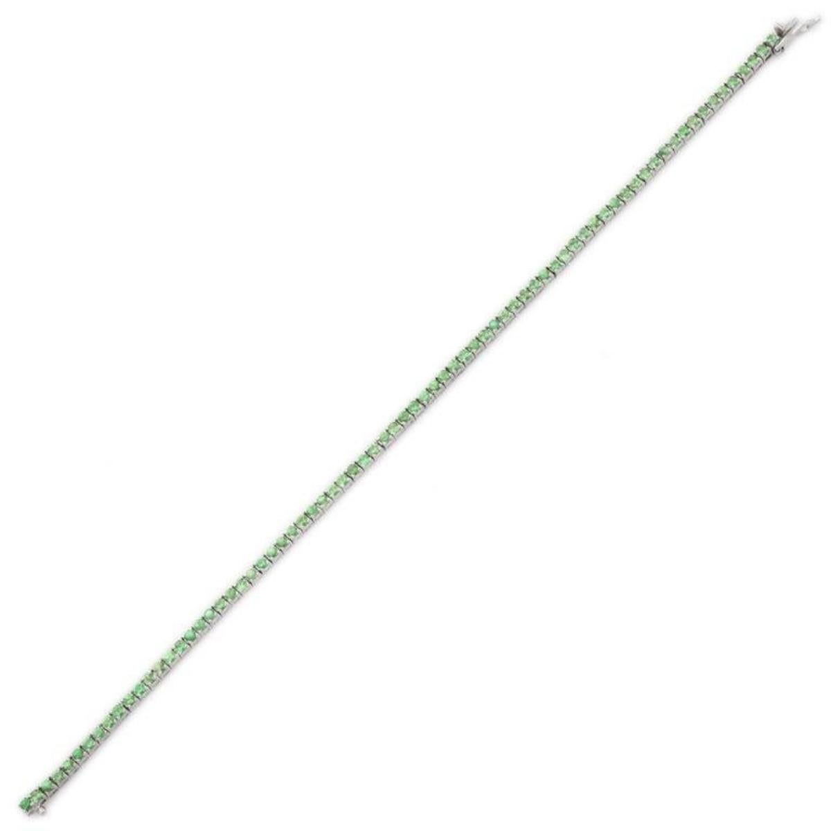 Minimalist Round Cut Tsavorite Sleek Tennis Bracelet in 18k Solid White Gold showcases 75 endlessly sparkling natural tsavorite, weighing 4.25 carats. It measures 7.25 inches long in length. 
Tsavorite increase the wearer's strength and