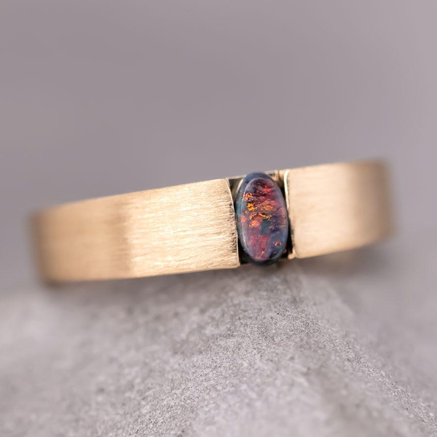 Minimalist Satin Finish Australian Black Opal Band 18K Yellow Gold.



Free Domestic USPS First Class Shipping! Free Gift Bag or Box with every order!

Opal—the queen of gemstones, is one of the most beautiful gemstones in the world. Every piece of