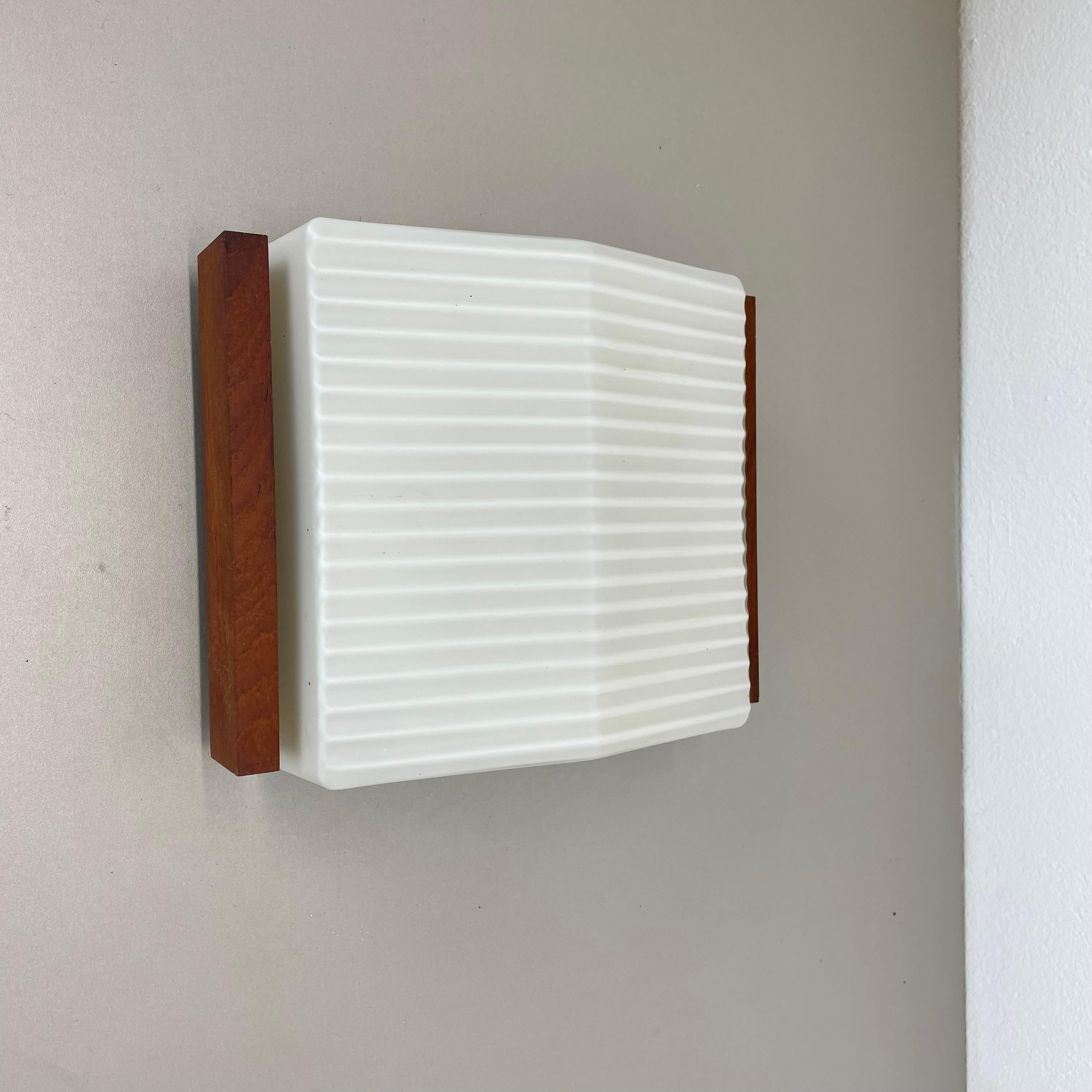 Article:

wall light


Origin:

Germany


Producer:

BEGA Lights, Germany



Age:

1960s




This modernist wall light was produced in Germany by BEGA Lights in the 1960s. The light has metal wall fixation and large satin white glass stacking