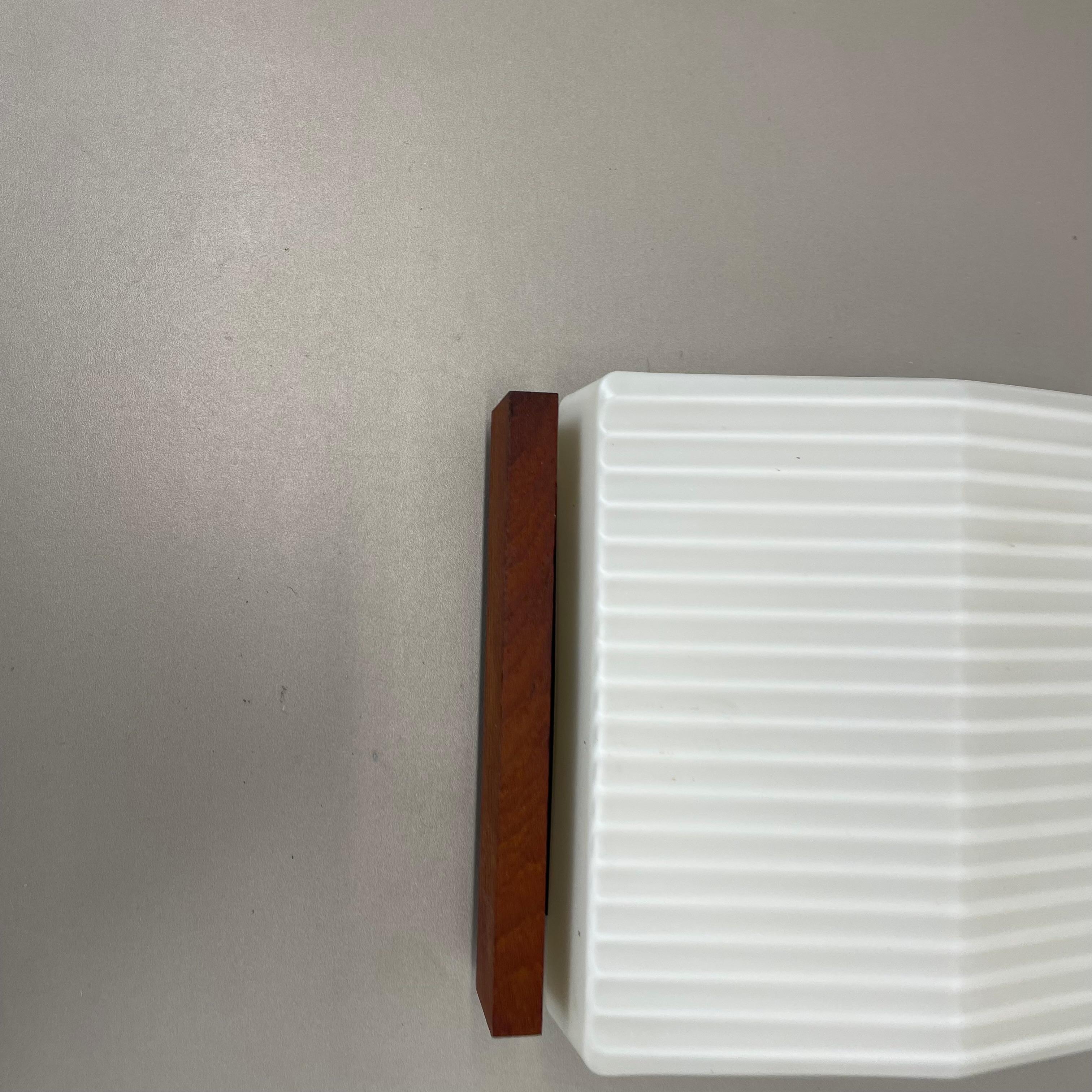 Mid-20th Century minimalist satin white glass and teak Wall Light by BEGA Lights, Germany 1960s For Sale