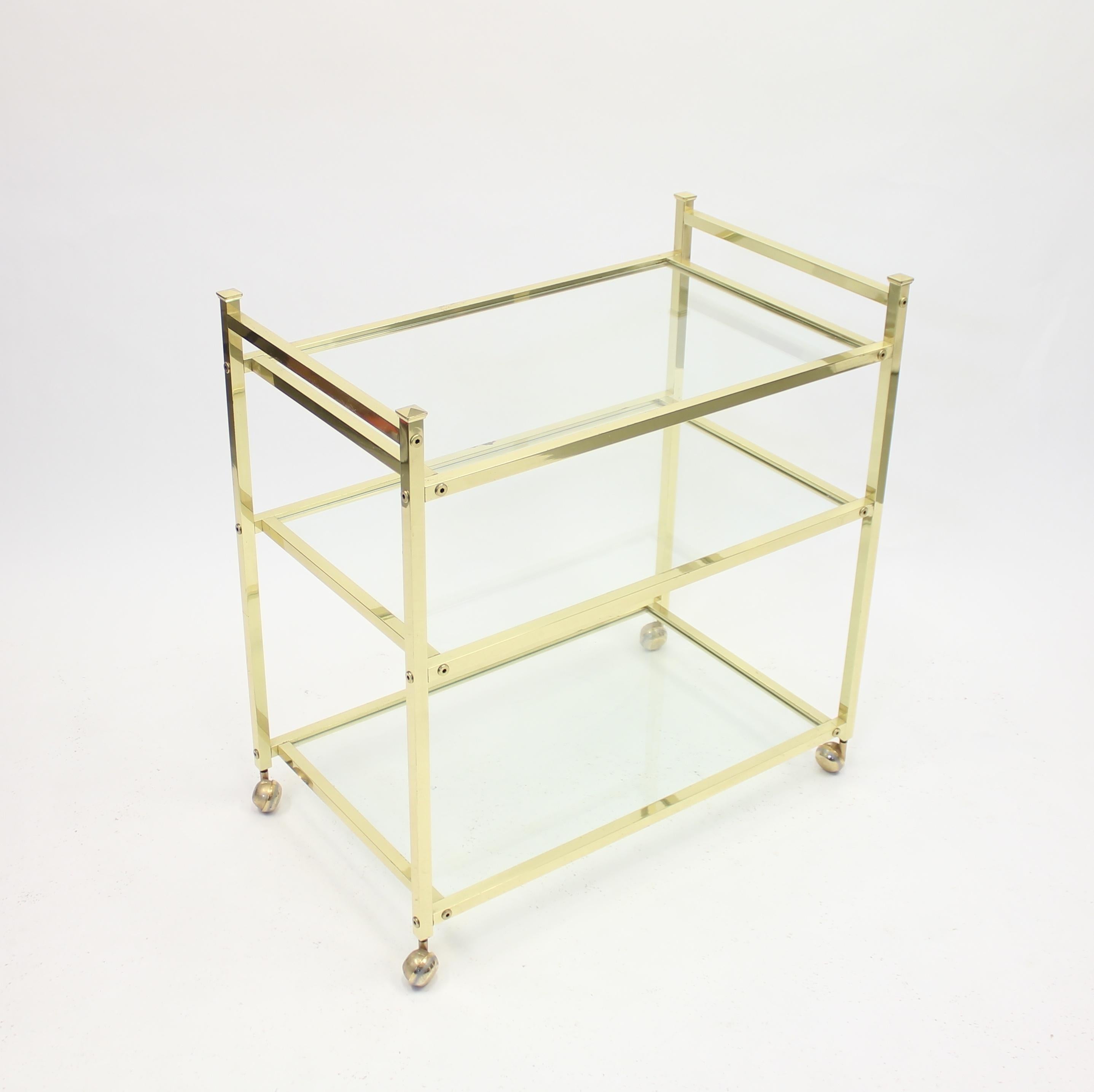 Minimalist Scandinavian bar or serving cart in brass from the 1970s. Very good condition with light ware consistent with age and use including a few small darker spots on the brass on one side.