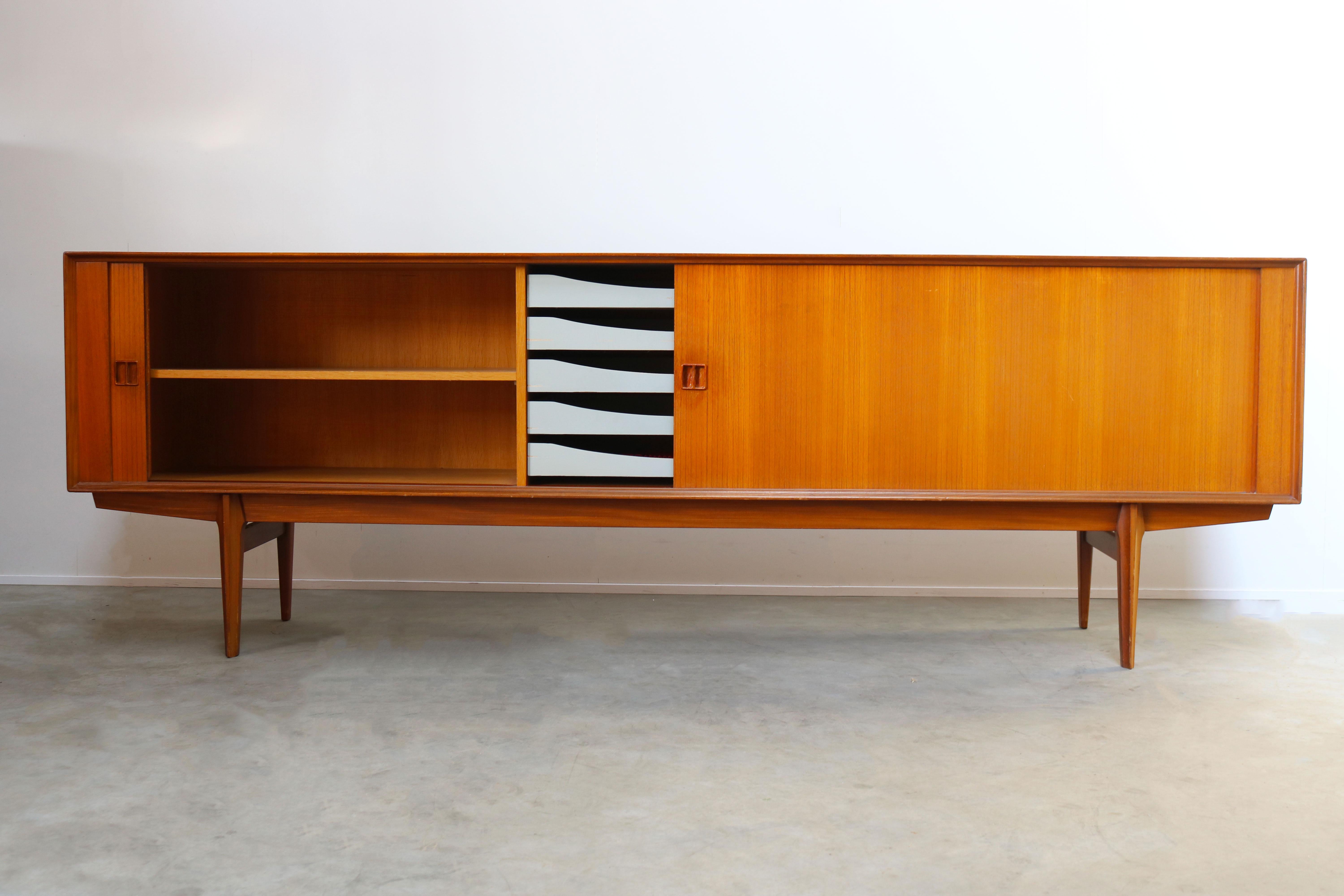 Gorgeous Minimalist sideboard / credenza by designer Oswald Vermaercke for V-Form in the 1950s.
The sideboard has a amazing clean design. The tambour doors disappear completely when opened and the craftsmanship on this piece is exceptional. Amazing
