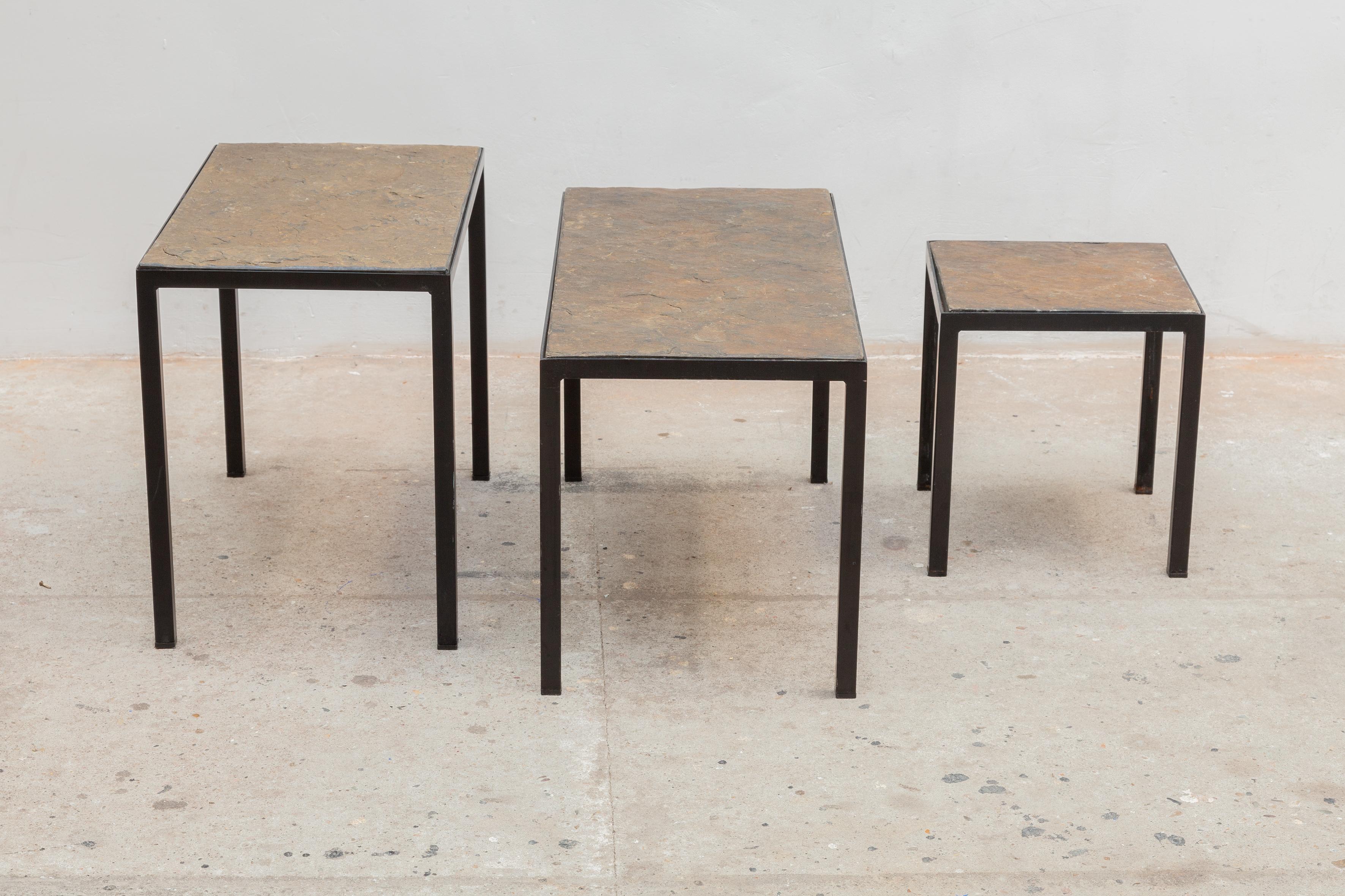Vintage Mid-Century Modernist nesting or side tables. Black iron frames with fossil slate stone tops, very stable and strong. These set of tables are perfect to use as side or end tables in your living-room. The set consists of three sizes and