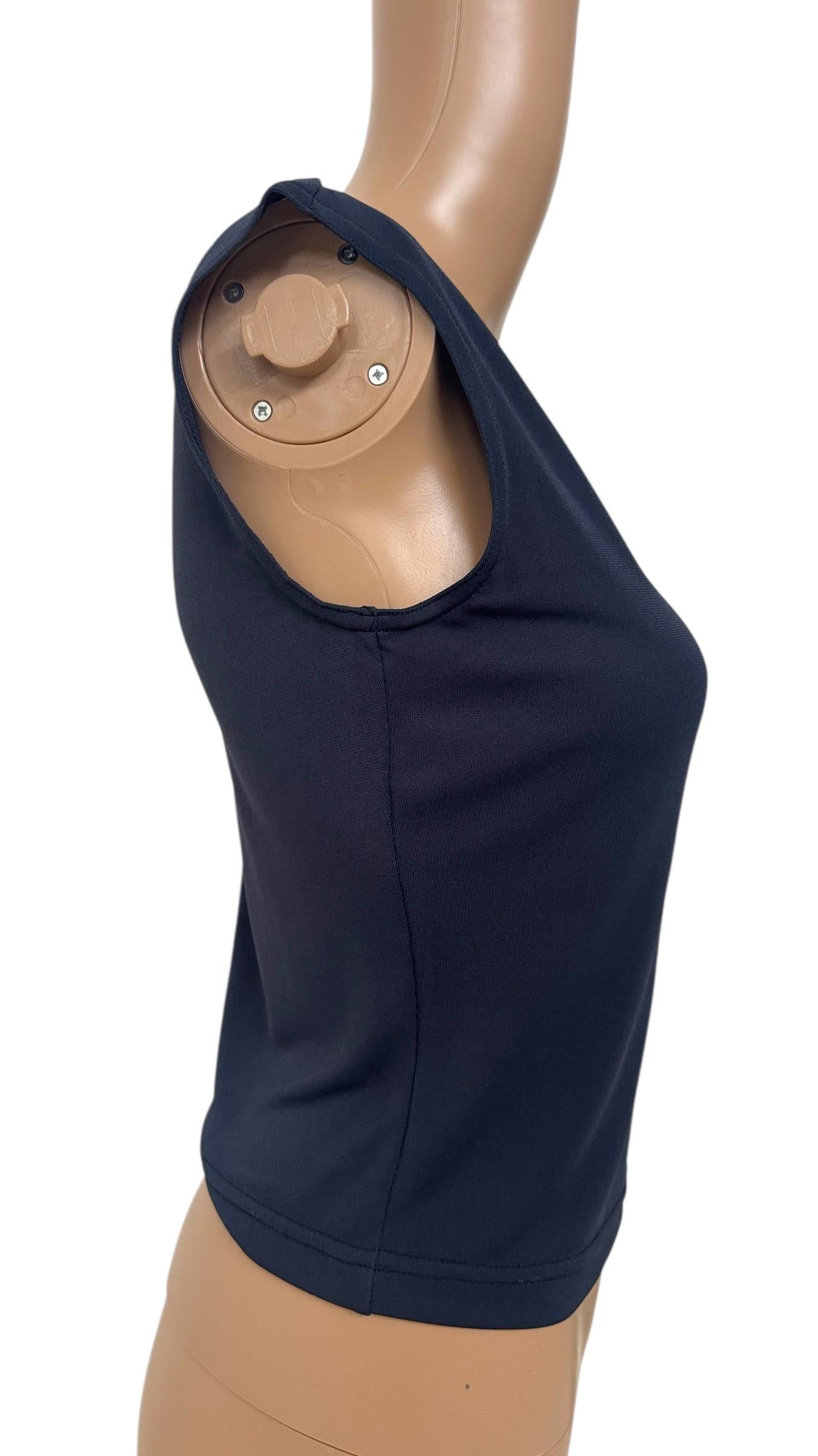 Understated elegance meets timeless design in this minimalist sleeveless top by Future Ozbek, a designer known for balancing modern sophistication with wearable silhouettes. Made in Italy, this navy blue piece is crafted from a smooth, lightweight