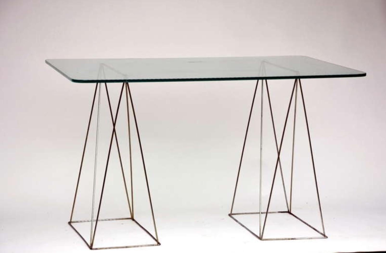Minimalist steel and glass trestle table.