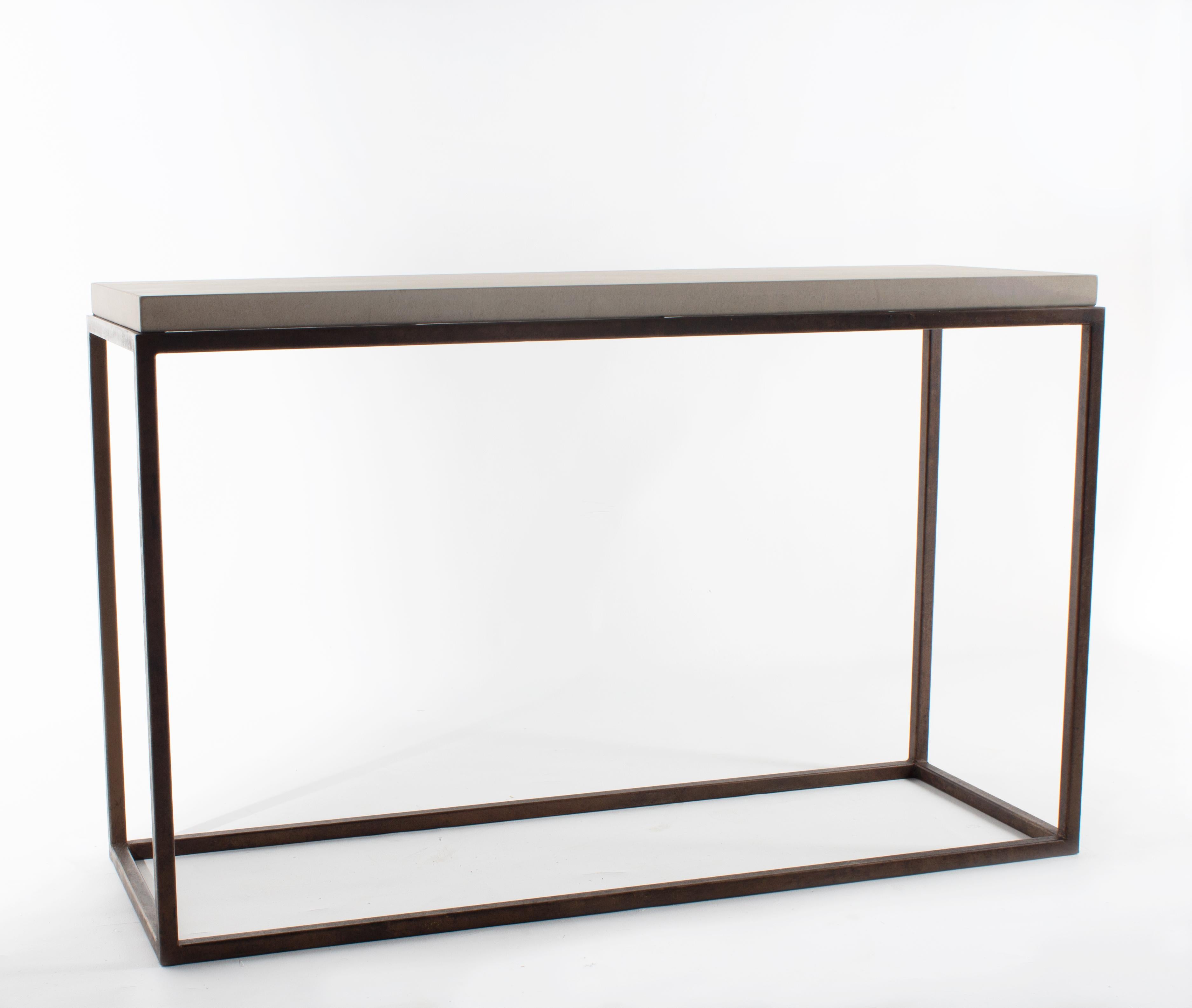 Minimalist console table with limestone top.
 
