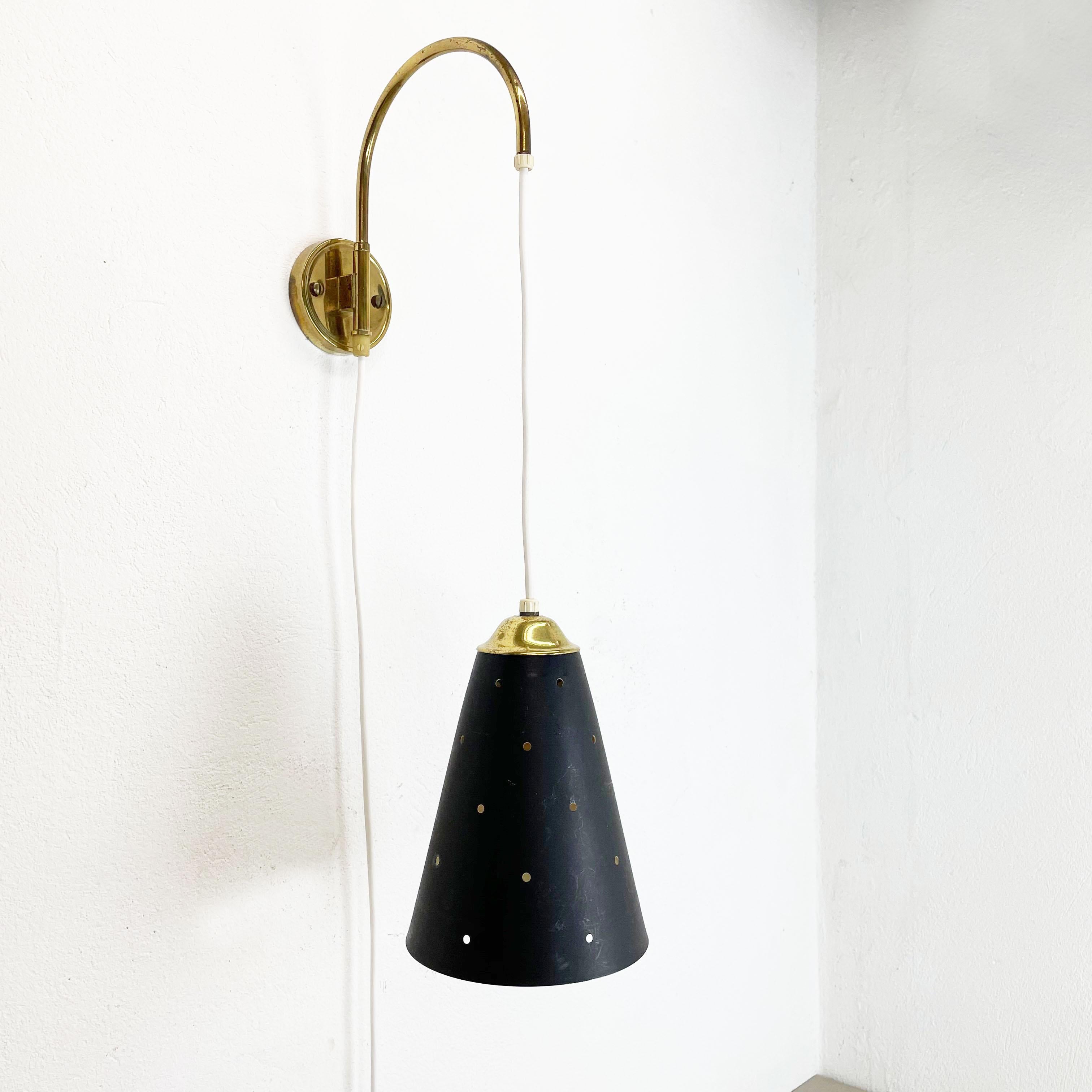 Article:

Wall light 


Origin:

Italy


Decade:

1960s



This wall light was designed and produced in Italy in the 1960s. The wall fixation of this light and the light arm with fixation for the shade are made of brass. The light