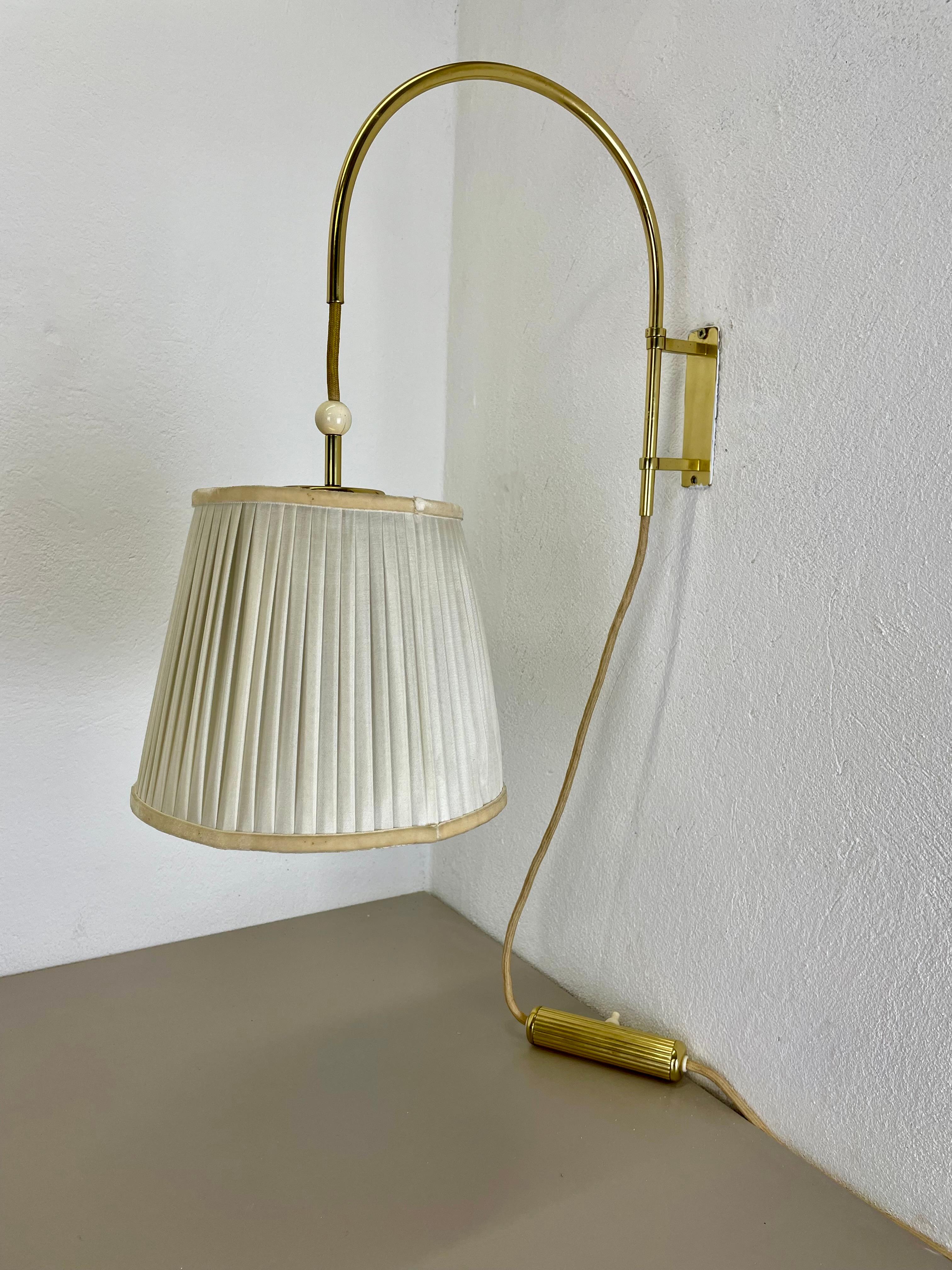 Article:

Wall light 


Origin:

Italy


Decade:

1960s





This wall light was designed and produced in Italy in the 1960s. The wall fixation of this light and the large light arm with fixation for the shade are made of solid brass. The light