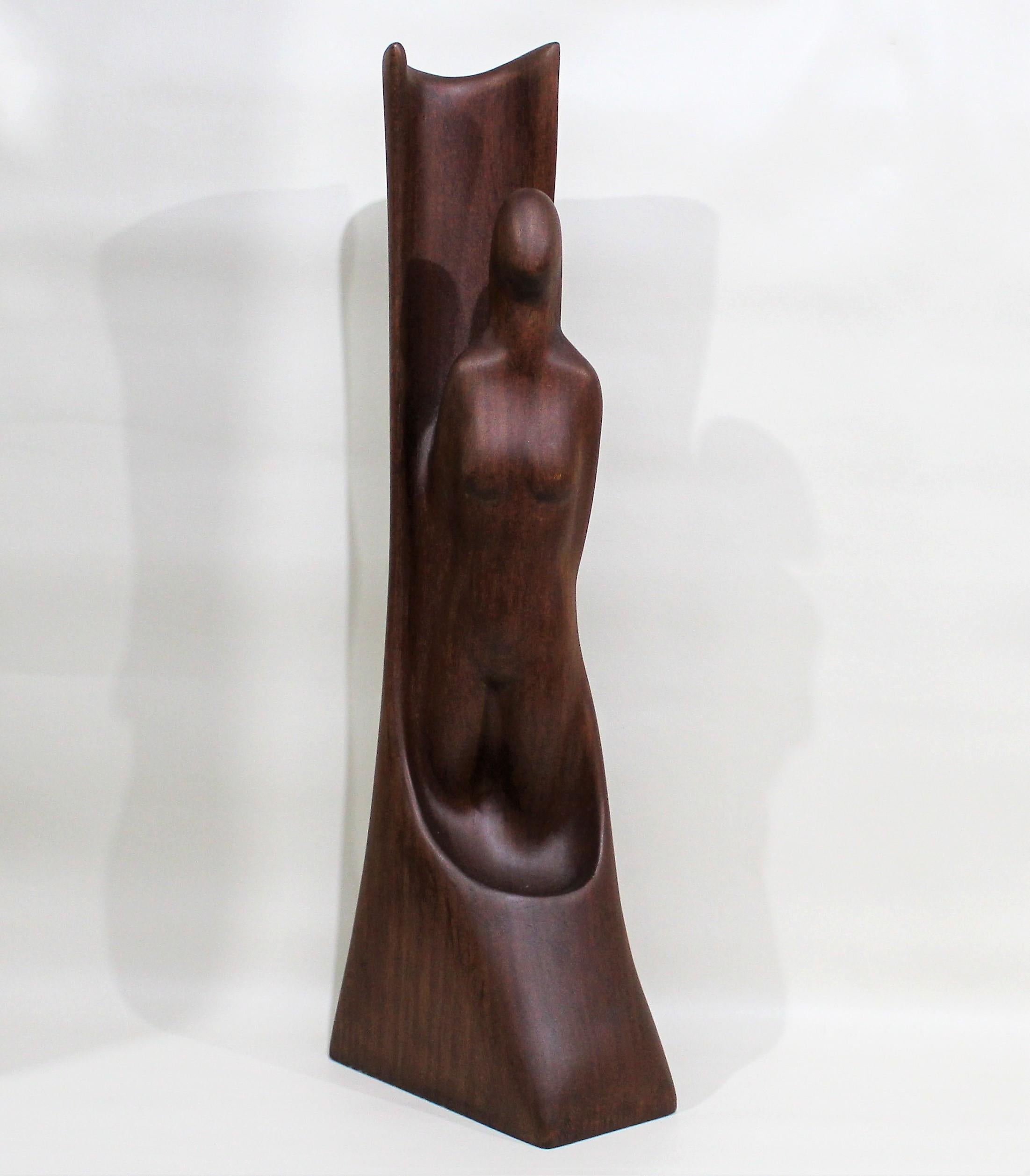 Minimalist teak wood nude woman sculpture.