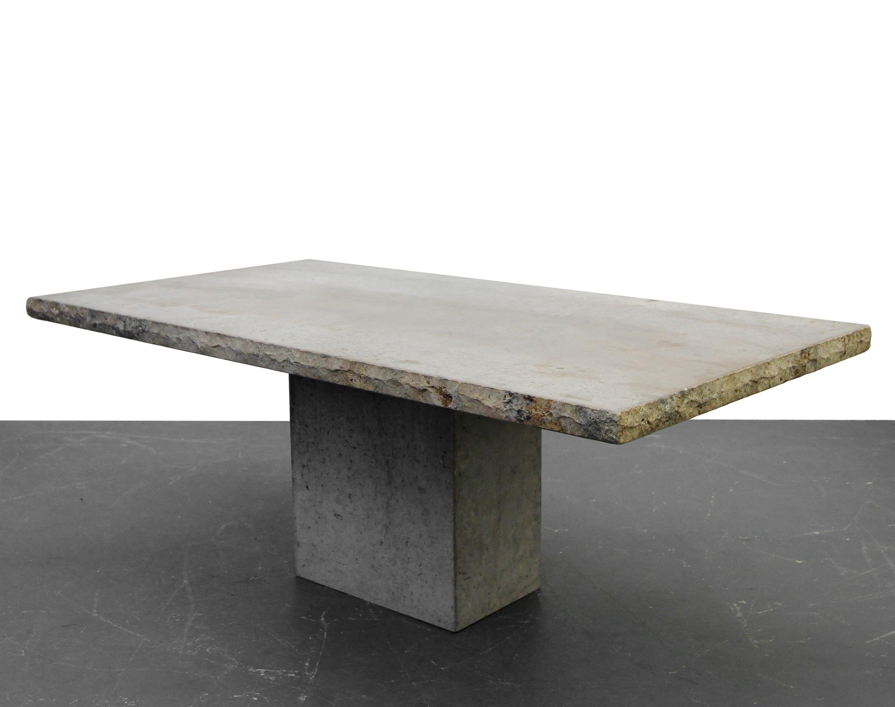 Nothing short of amazing. Solid travertine dining table straight from Italy. Has the appearance of polished concrete. A clear finish could be applied to bring out more of the color in the travertine, but we love the Industrial, raw appearance, of
