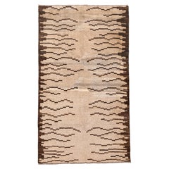 Tappeto Tulu minimalista in beige e marrone