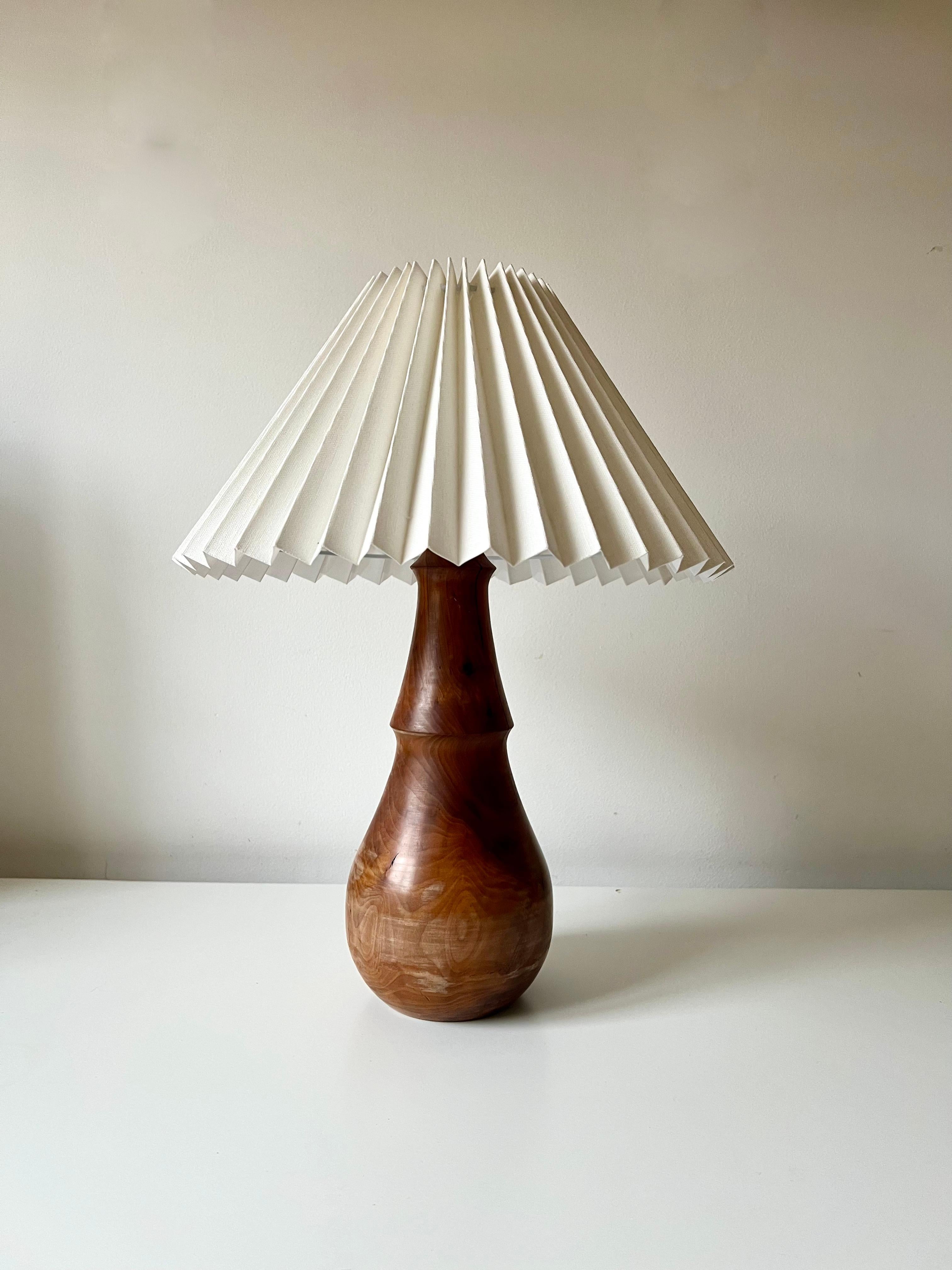 Turned Minimalist turned wood table lamp with linen pleated shade