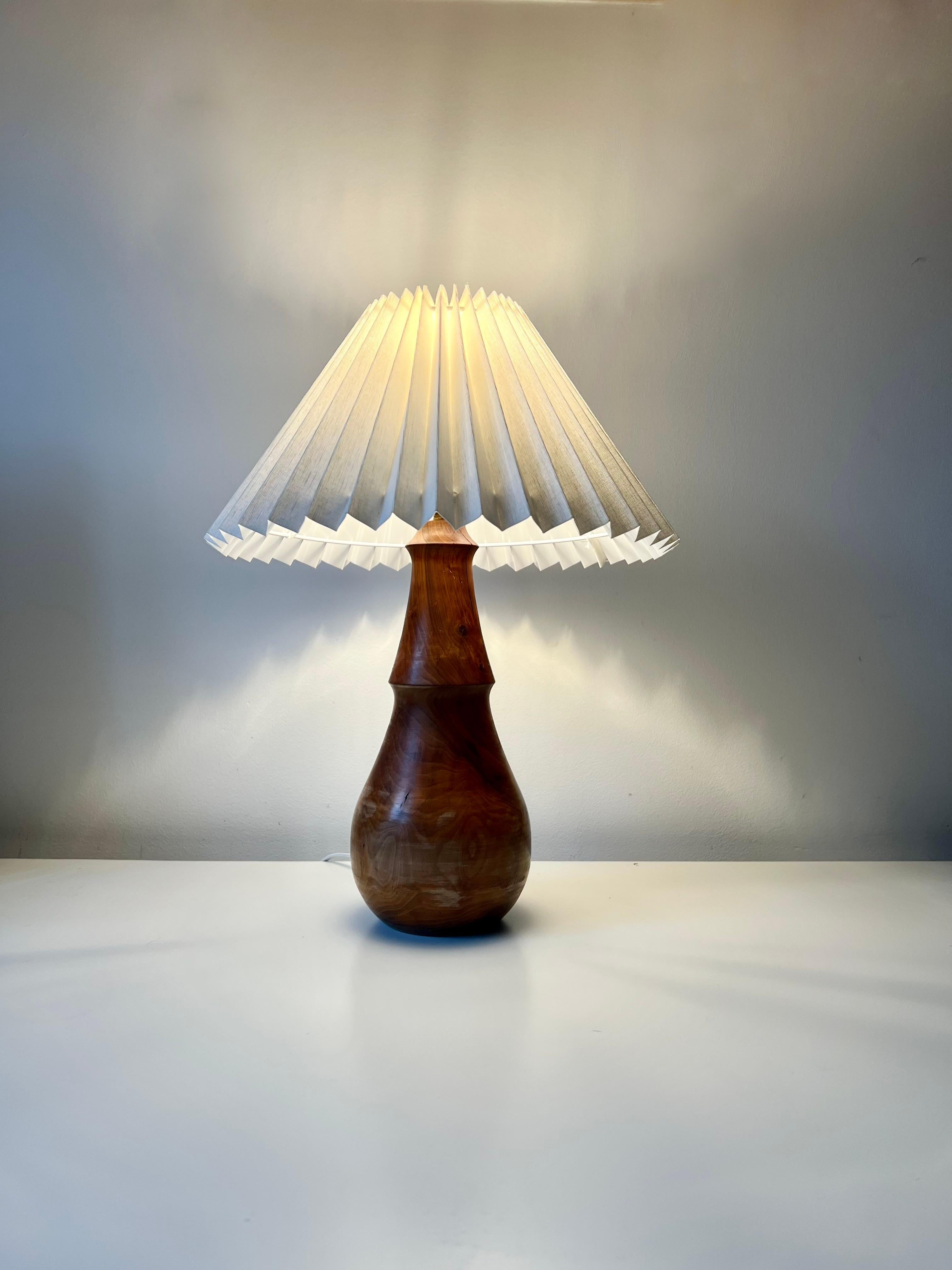 Fruitwood Minimalist turned wood table lamp with linen pleated shade