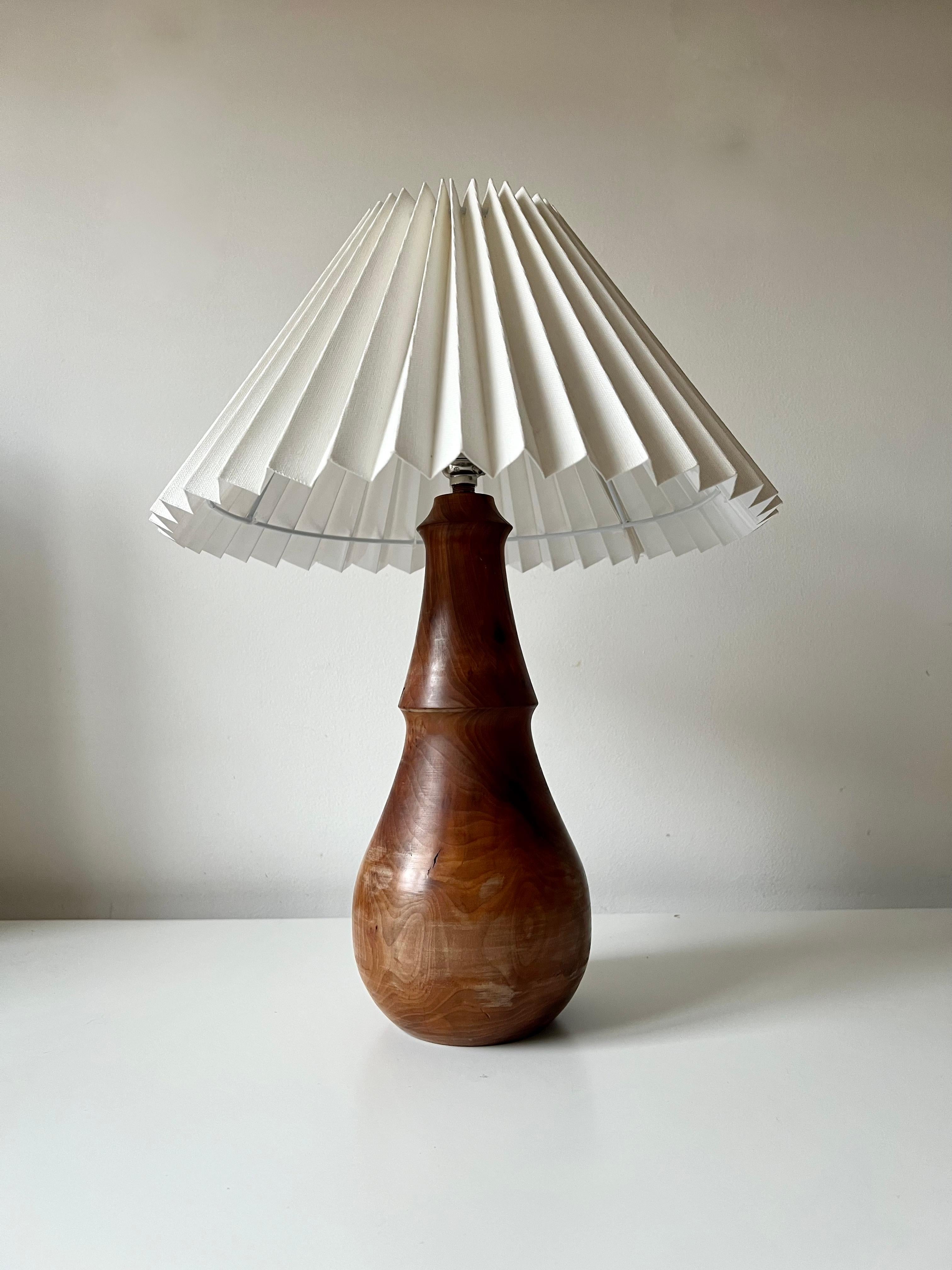 Minimalist turned wood table lamp with linen pleated shade 1