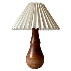 Minimalist turned wood table lamp with linen pleated shade