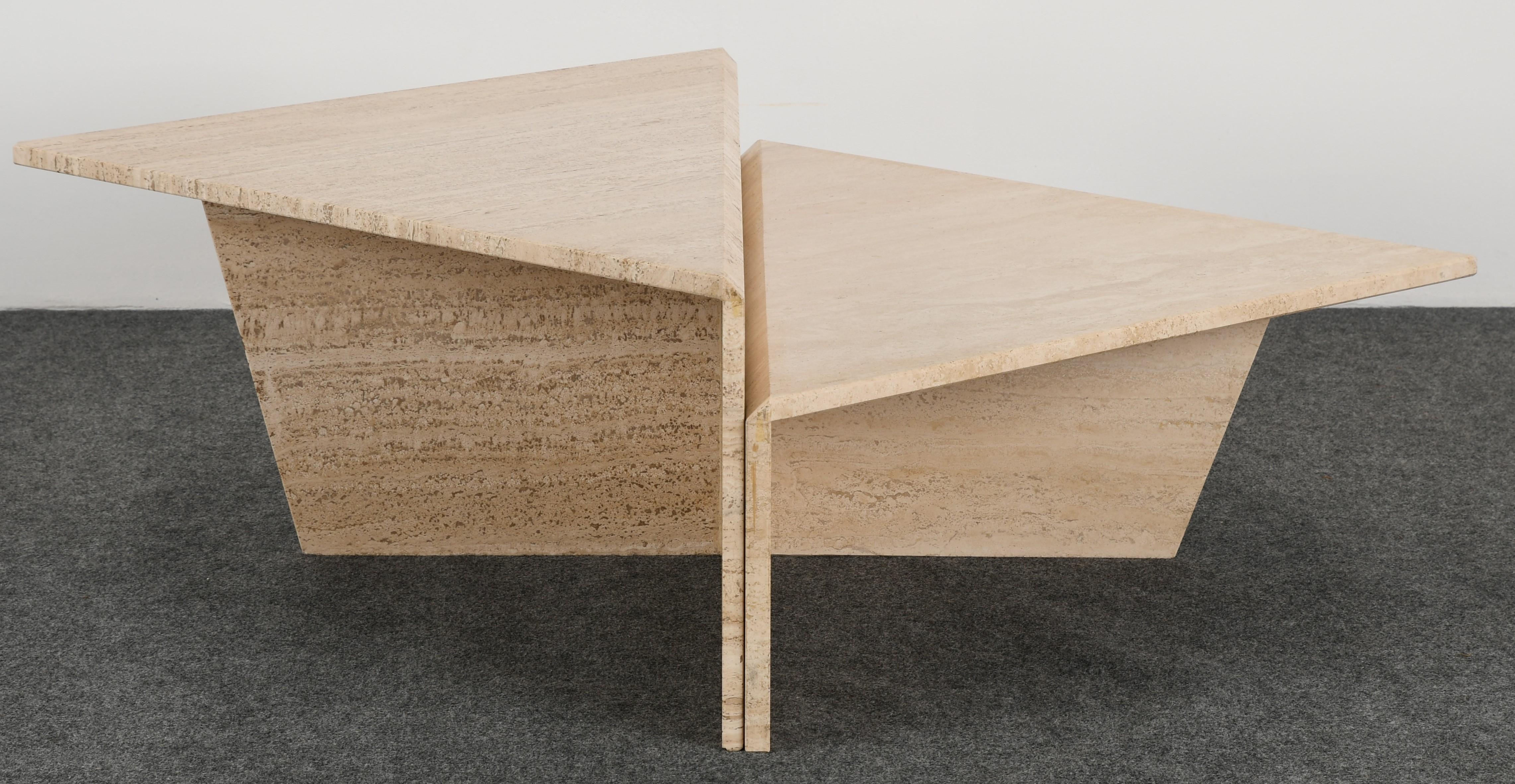 A two-piece, industrial style artist and architecturally designed Travertine marble two-tier coffee table. This unique and versatile coffee table set can be used in a modern or traditional setting. In good condition with age appropriate