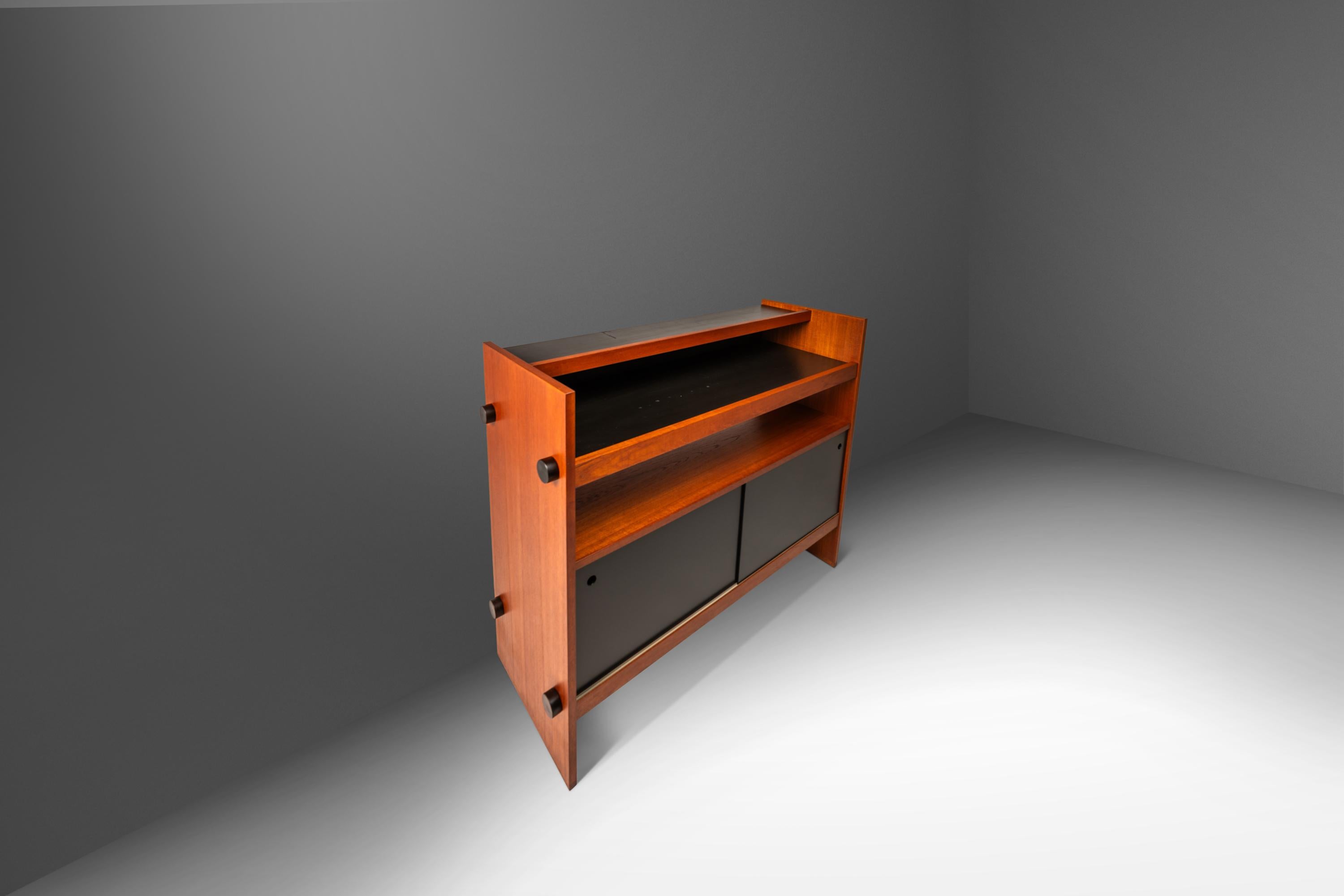 Introducing an exceptional Danish-made dry-bar with ultra-minimalist lines and stance. This petite bar is the epitome of functional art and the perfect example of what two contrasting tones can do in a single piece of furniture with flat black