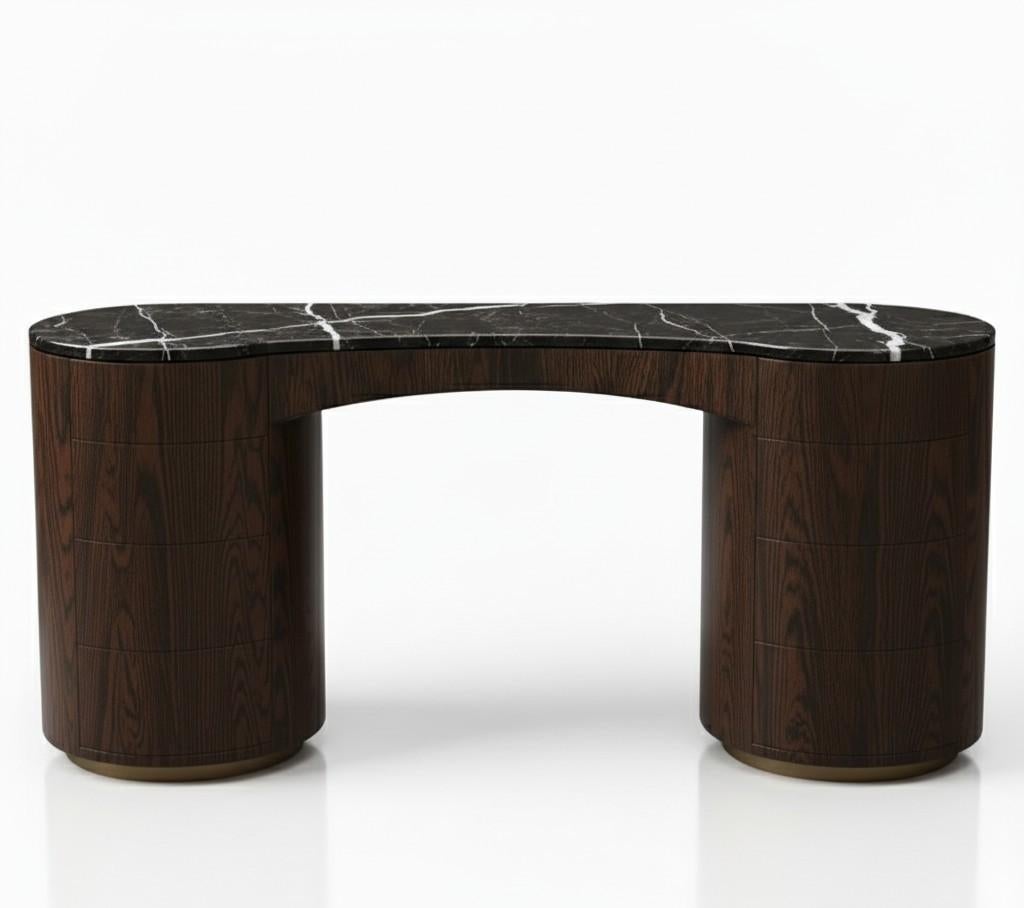 This dressing vanity is a sculptural masterpiece, defined by its bold yet refined silhouette. The design features a curved, contoured top crafted from luxurious marble, supported by two cylindrical bases. The rounded forms and seamless finish give