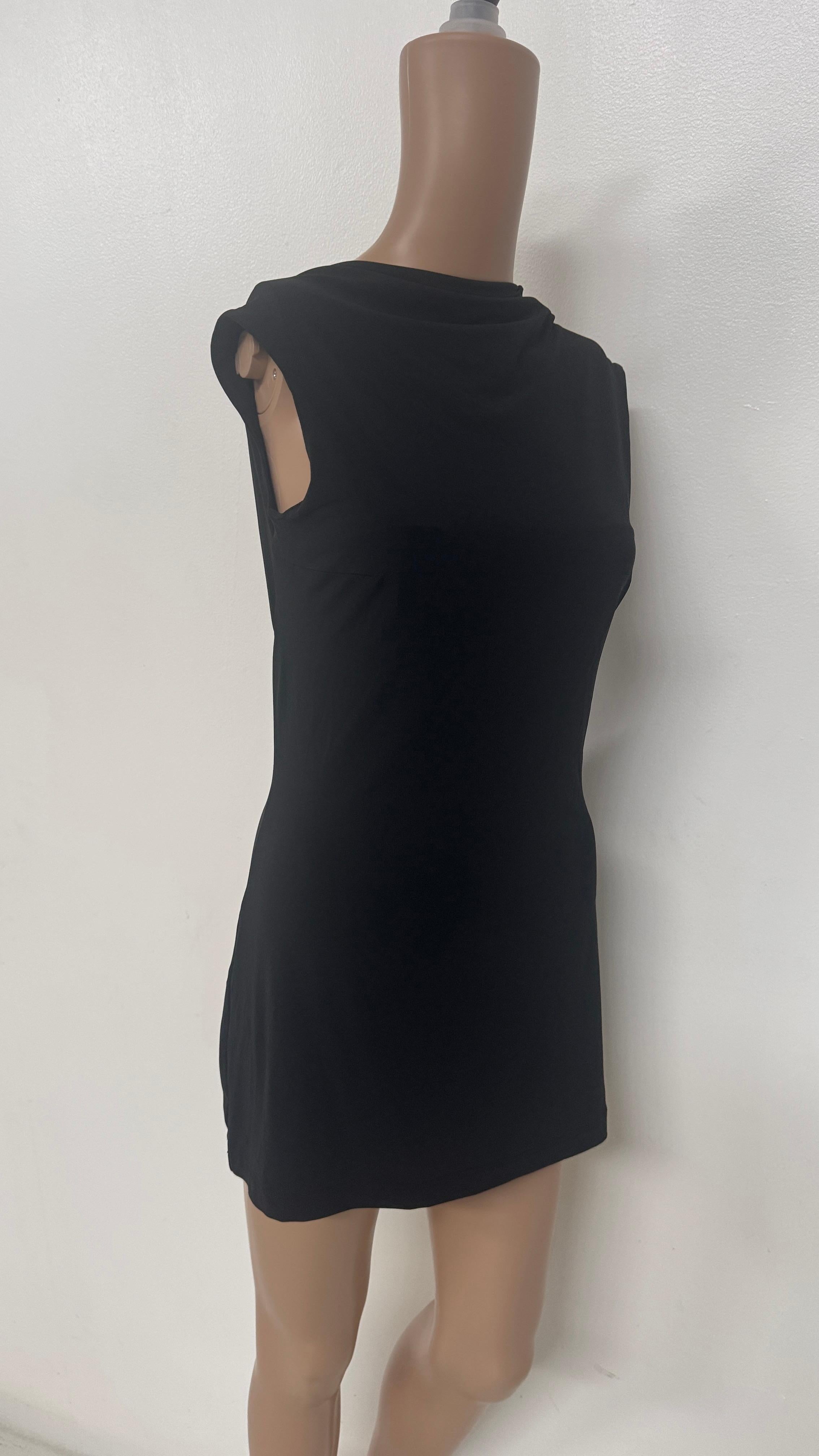 Effortlessly elegant and seductive, this vintage black dress by Plein Sud is a timeless example of minimalist French design. Crafted in France from a soft stretch fabric, it gently hugs the silhouette, offering both comfort and a flattering fit. The