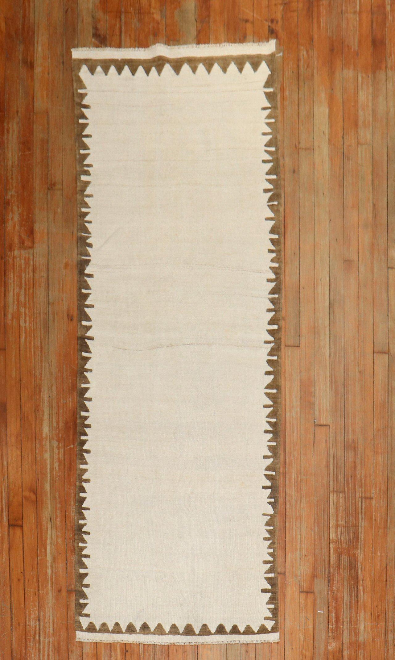 Mid-20th century small narrow Turkish Kilim runner in the style of Mid-Century Modern.

Measures: 2'8'' x 7'3''.