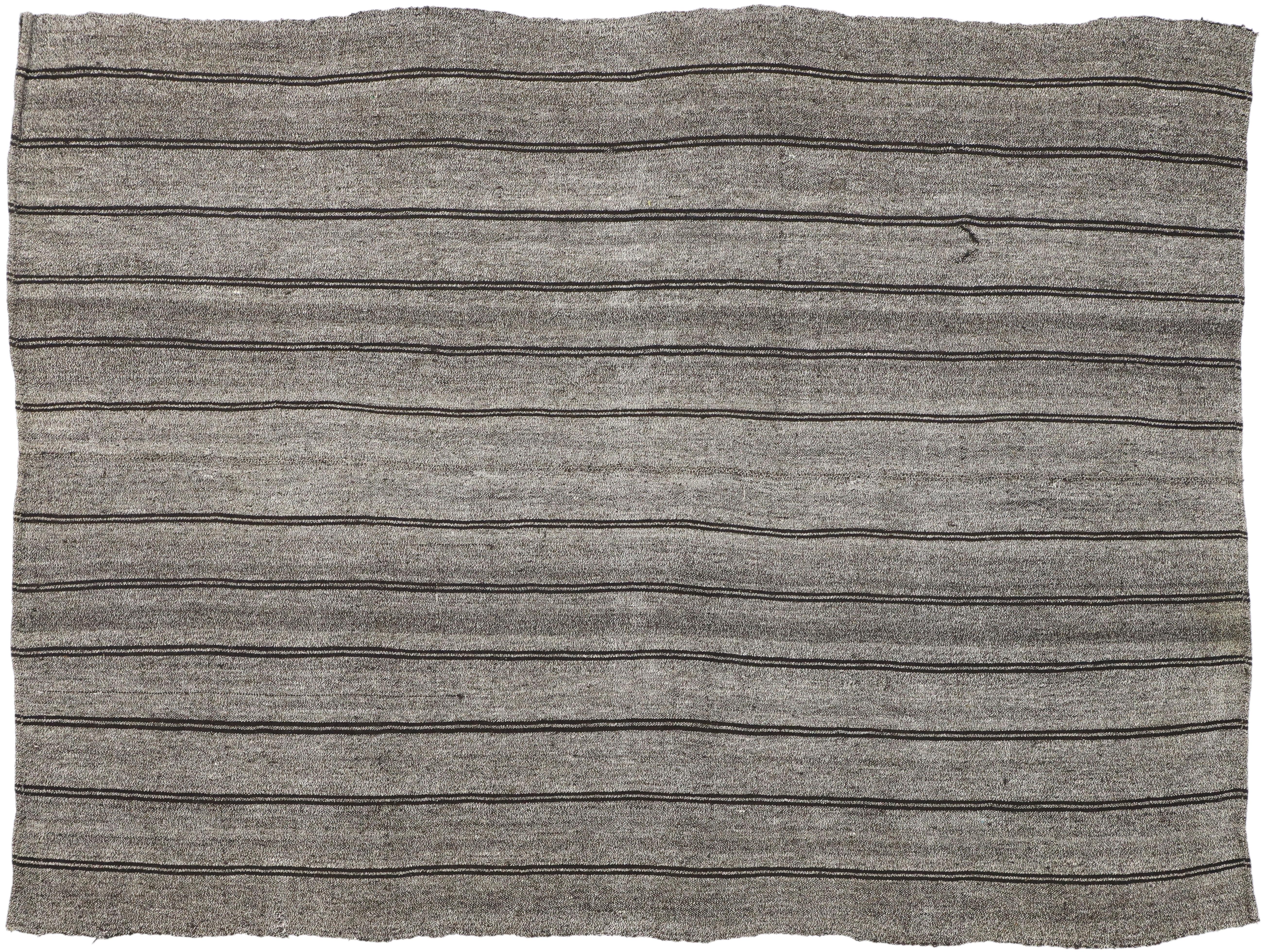 50898 Vintage Turkish Striped Kilim Rug with Modern Industrial Style 06'09 x 09'00. Simplicity meets incredible detail and texture in this hand-woven vintage Turkish Kilim rug. The abrashed gray field features pairs of thin black stripes running the