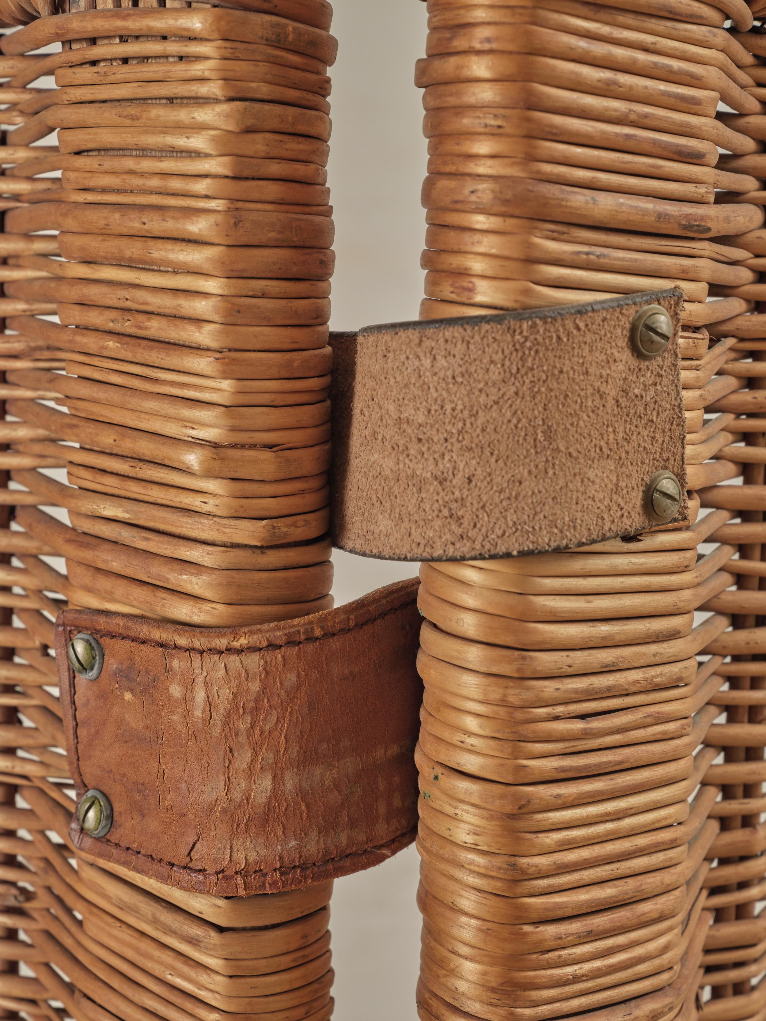 Minimalist wicker dividing Screen with leather hinges.


