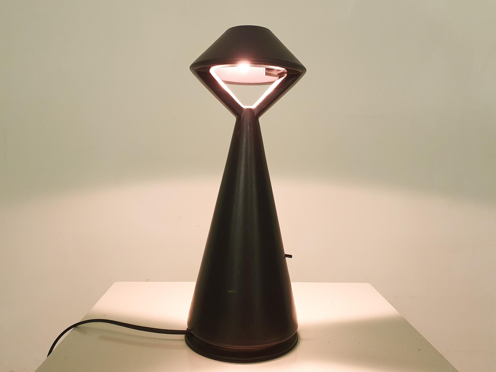 Black ceramic table or desk light with a small switch on the side. In good original condition.

