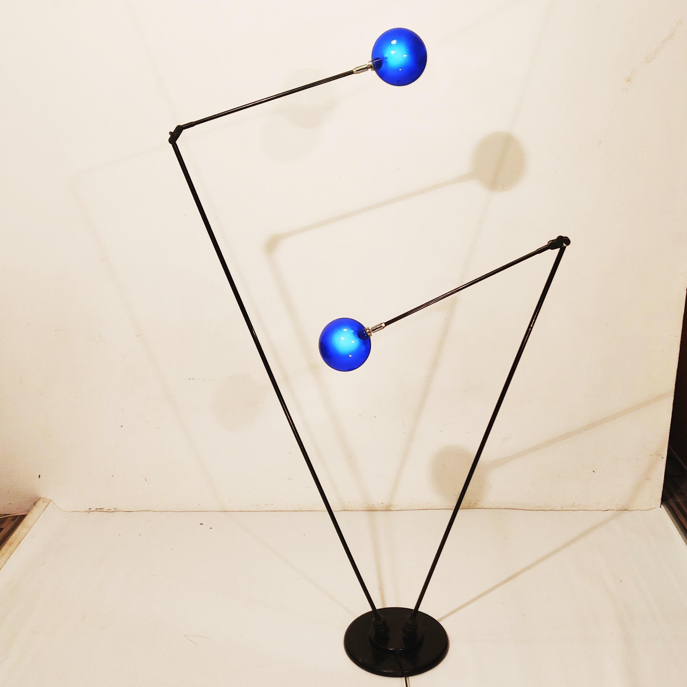 Minimalistic dutch Design floor lamp by Pola Design Amstelveen, 1980s.
Arms are movable in any directions, the shade's are made of blue frosted round glass. These round shape of blue frosted glass is rare, most of the Pola design floor lamps have
