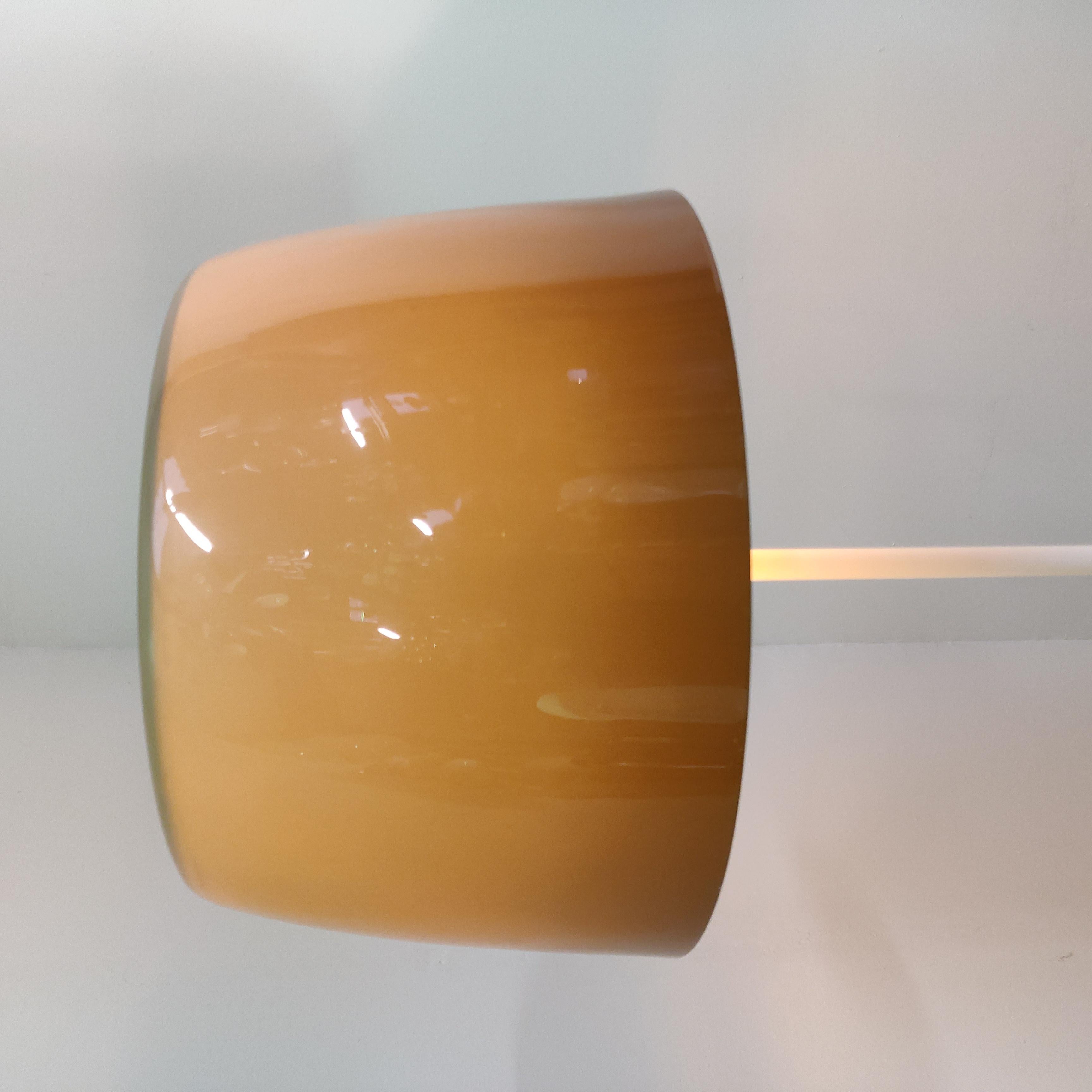 Minimalistic floor lamp in style of Harvey Guzzini, with lucent brown acrylic lampshade, switch for only top light, top light and shade or only shade light.
