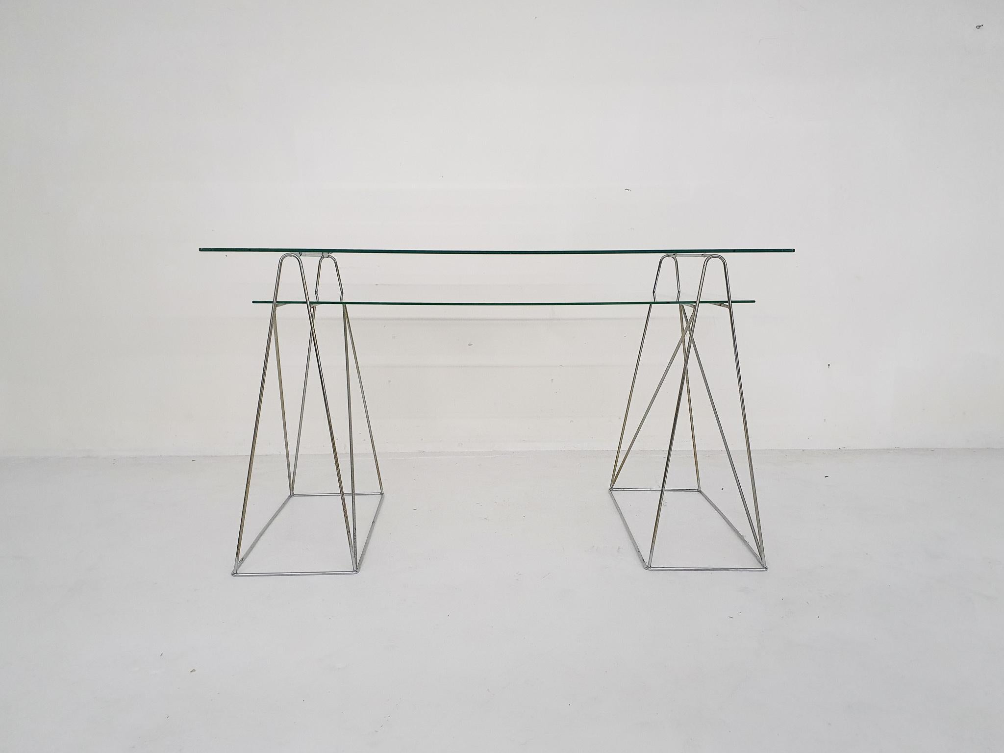 Minimalistic glass and metal desk, France 1970's

Metal wired desk with two glass shelves. The design reminds us of the work of Max Sauze.
The metal has some rust. The glass is in good condition.

