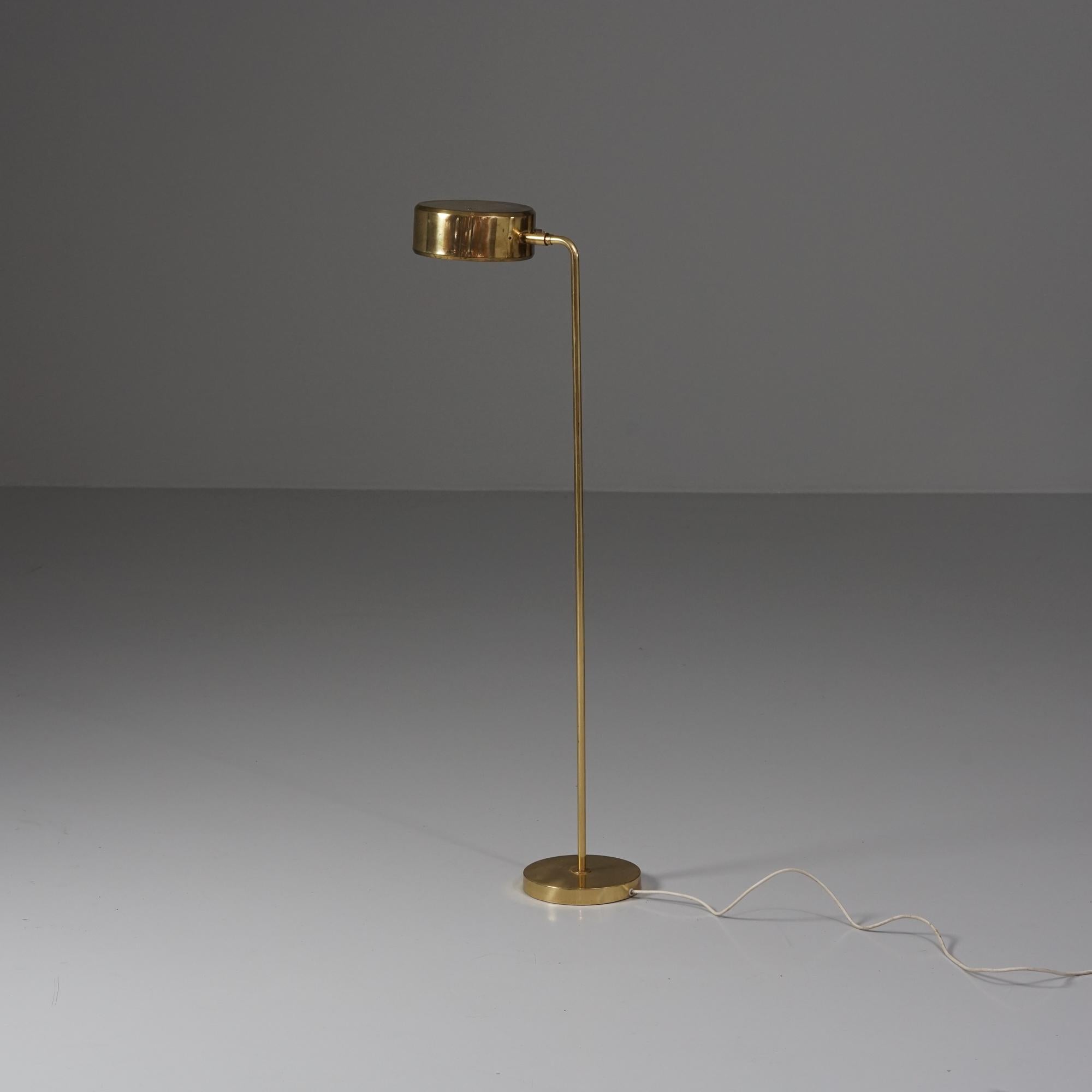 Minimalistic model Olympia floor lamp, designed by Anders Pehrson, manufactured by Ateljé Lyktan, 1970s. Brass. Adjustable lampshade. Good vintage condition, patina consistent with age and use. 