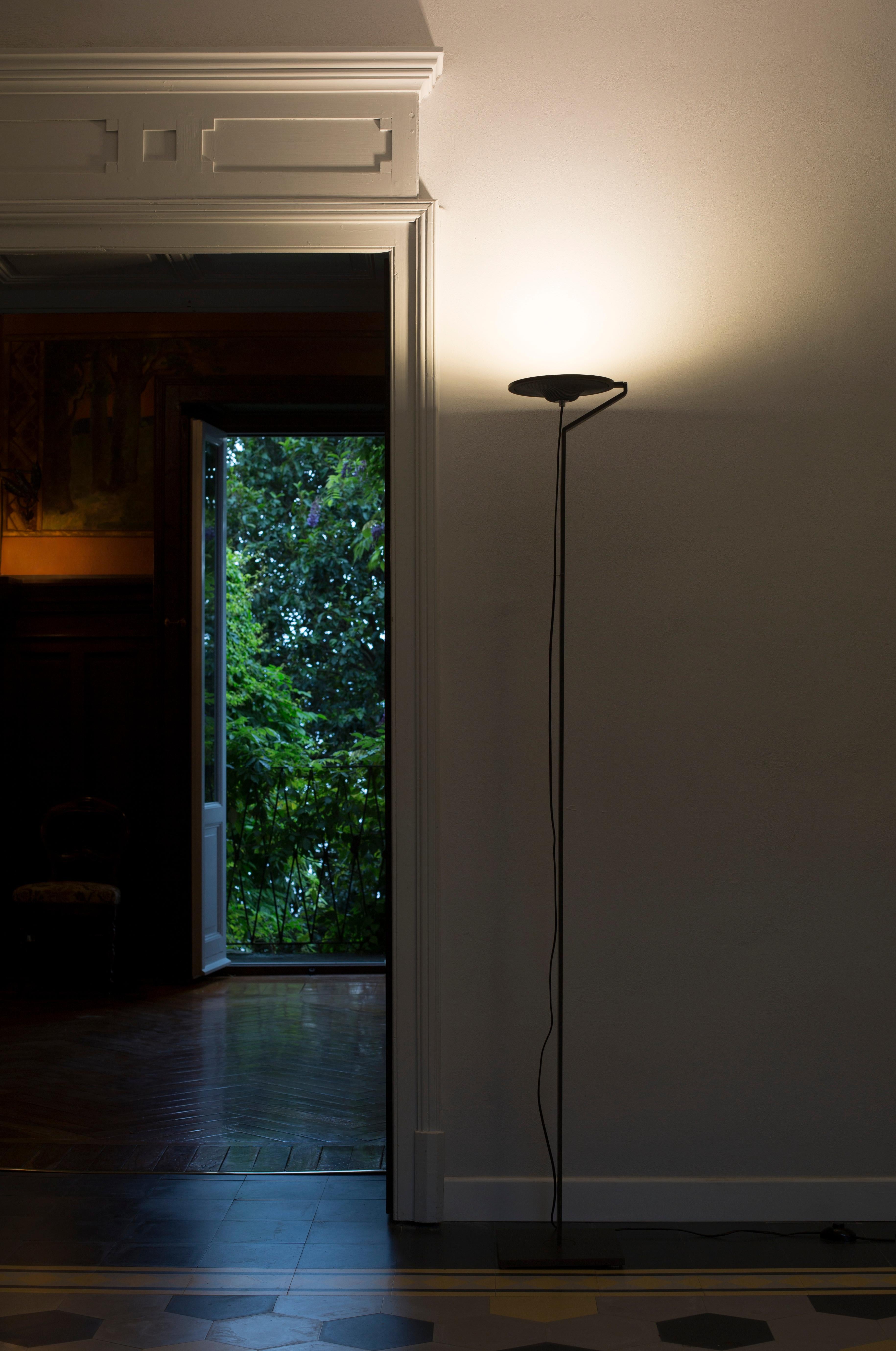 The Vega Terra floor lamp, designed by Belgian designer Stéphane Lebrun, is a striking piece that blends modern aesthetics with timeless elegance. Crafted with meticulous attention to detail, the lamp features a slender, geometric frame that