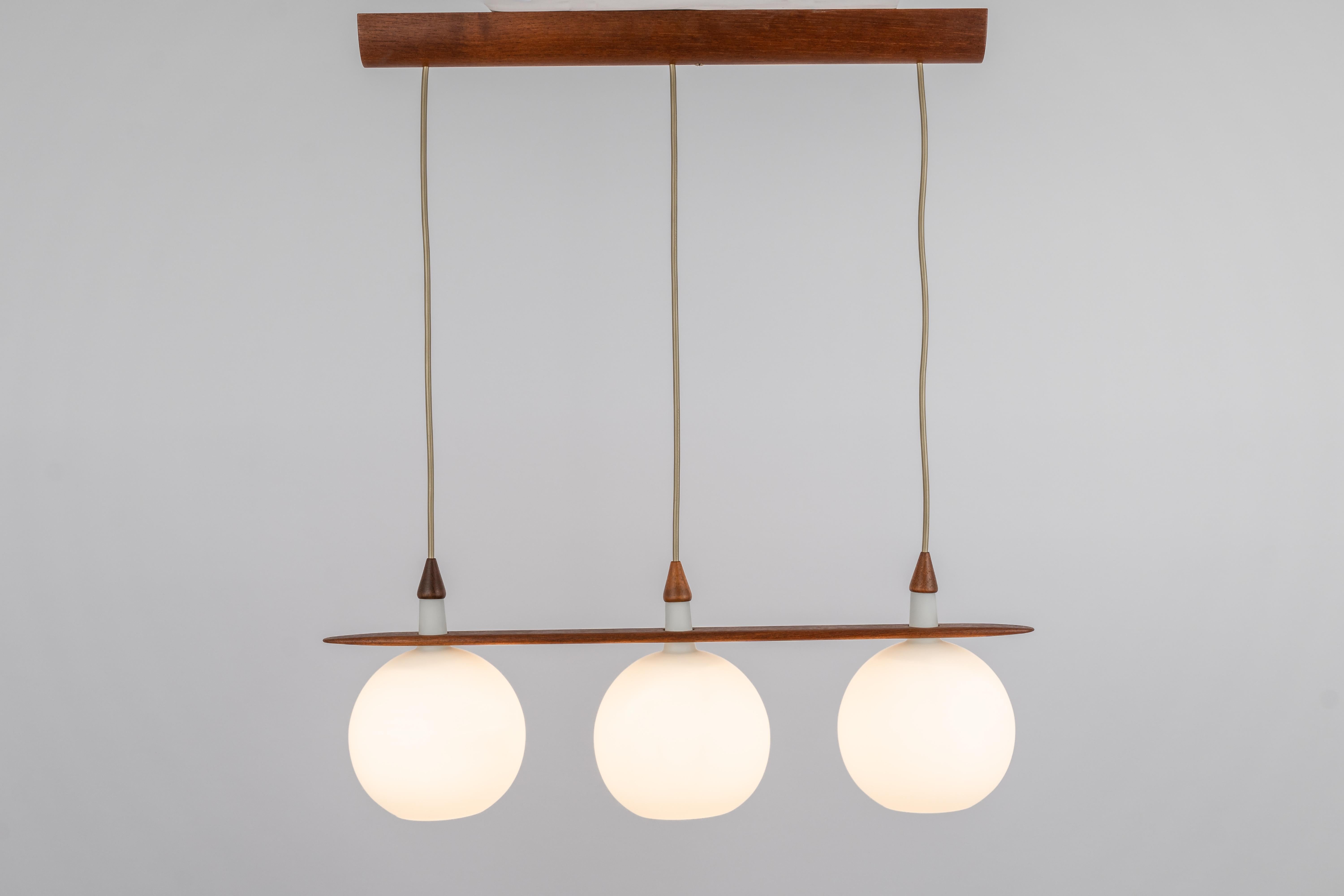 Mid-20th Century Minimalistic Teak and Opal Glass Pendant by Uno & Östen Kristiansson, 1960s For Sale