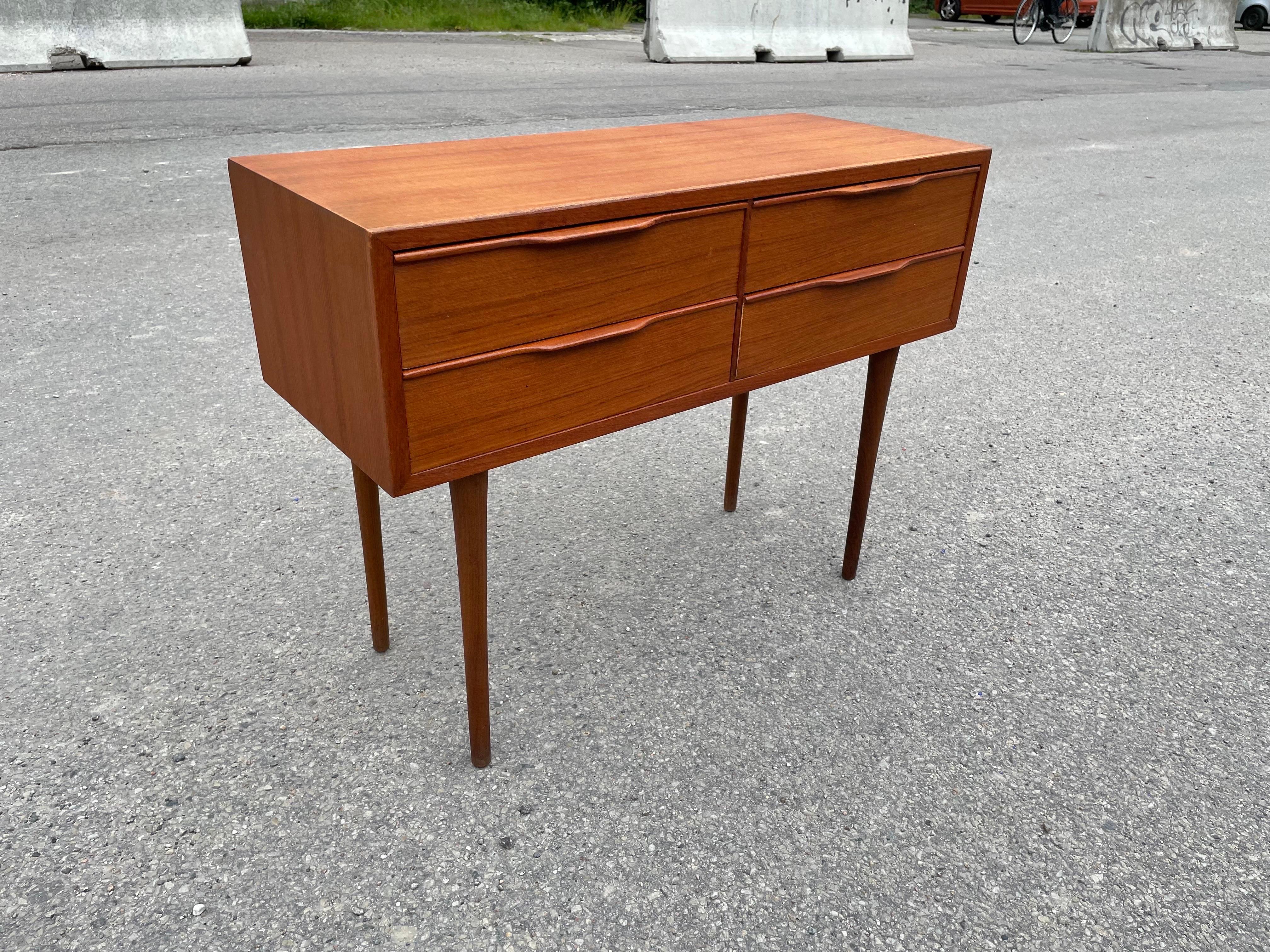 The elegant Mid-Century Modern dresser by Kai Kristiansen is a rarity of his design. The elegant slim legs gives it a beautiful fragile but still solid expression of excellent craftsmanship. A 1960’s dresser that blends in anywhere.