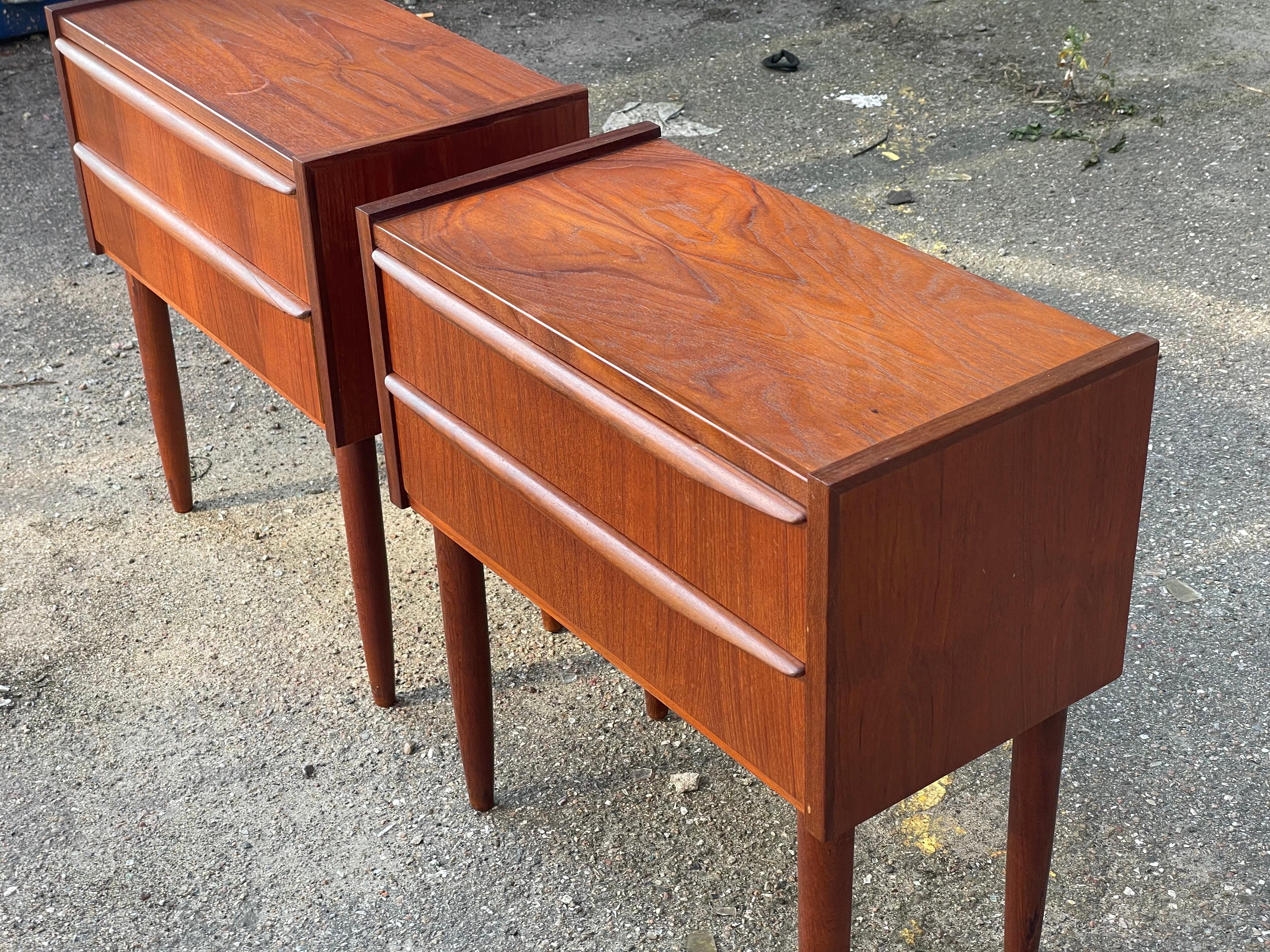 A pair of Danish teak nightstands from the start of the 1960´s. Each with two drawers in a original untouched version. They used to be common in Denmark, but nowadays very hard to find. Smooth and elegant and very functional. Check photos for the
