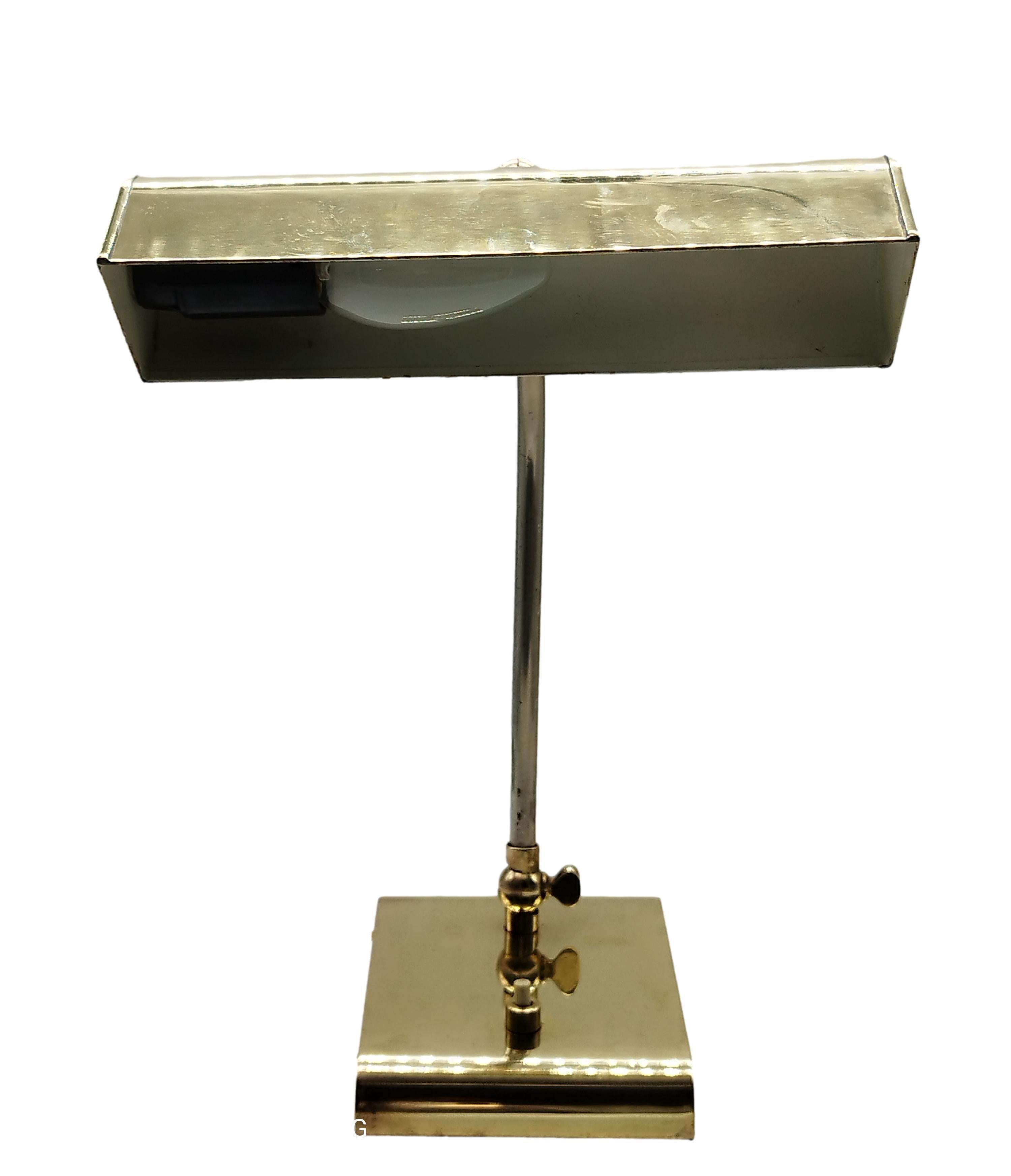 Brass table lamp with pivoting bell section. Good condition, totally brass, joints checked and working.
