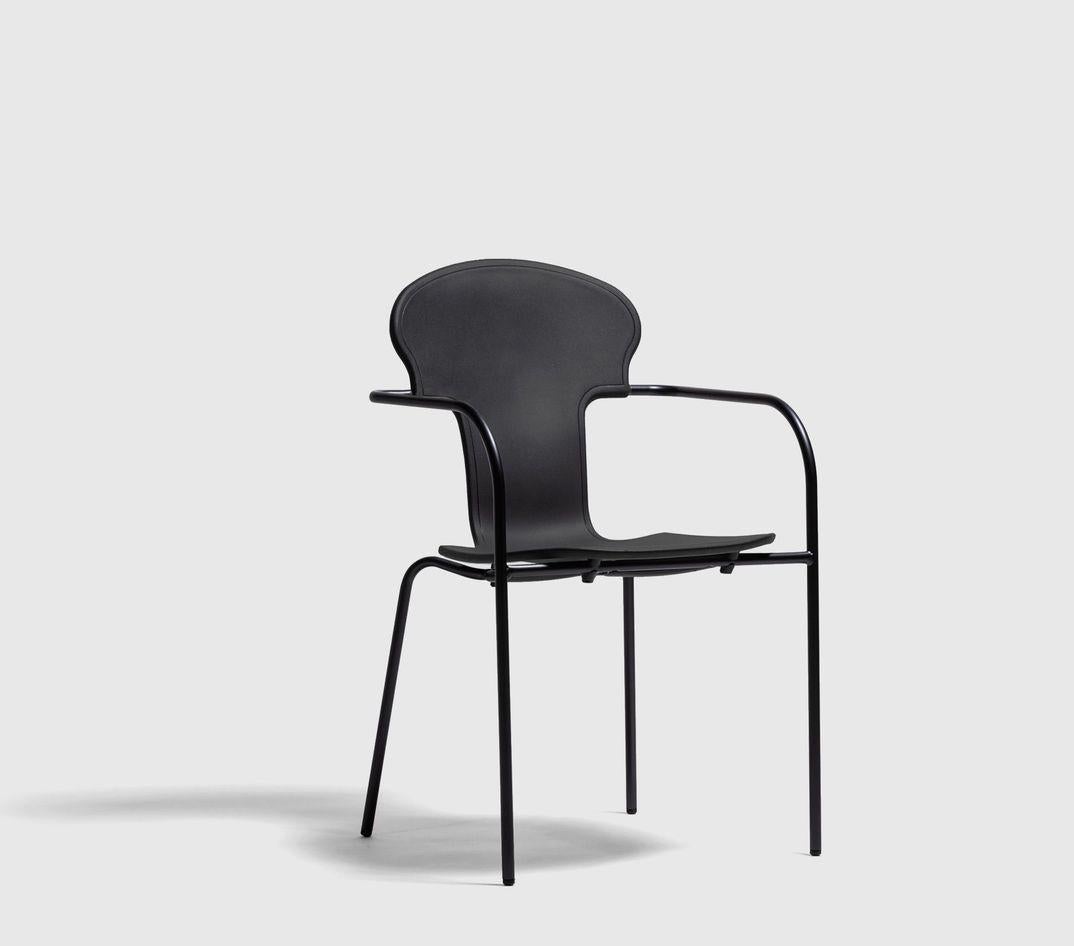 Minivarius chair by Oscar Tusquets
Dimensions: D 53 x W 52 x H 82 cm 
Materials: Structure in tubular steel painted in anodic black. A one-piece seat in gas-injected polypropylene in black or white. 
Available in different colors. Also available