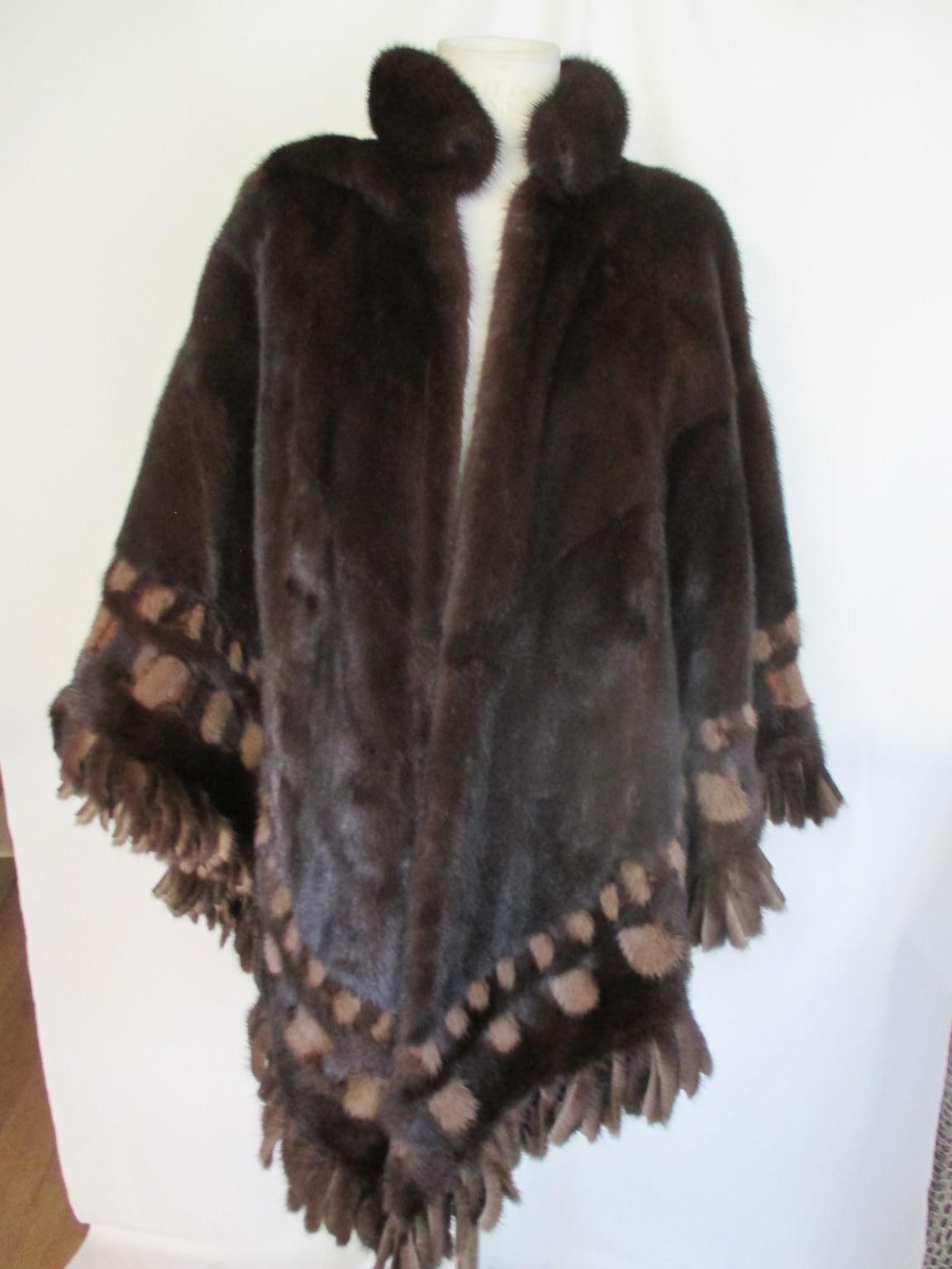 Exclusive rare reversible leather brown mink cape/stole

 We offer more luxury fur items, view our frontstore.

Details:
with fringed details
no pockets, no closure
one size
circumference aprox. 200 cm/ 78.74 inch

Please note that vintage items are