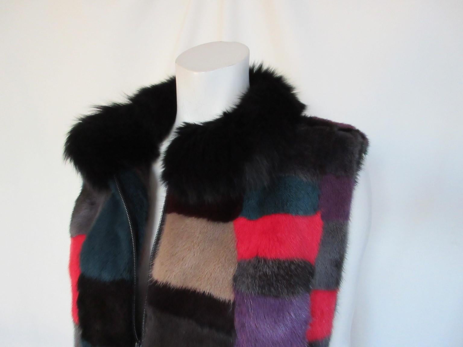 Exclusive soft mink fur vest with fox collar

We offer more exclusive fur items, view our frontstore

Details:
With 2 side pockets, 
closing zipper
fully lined
Colors; red, purple, black, brown
Size appears to be medium, please refer to the
