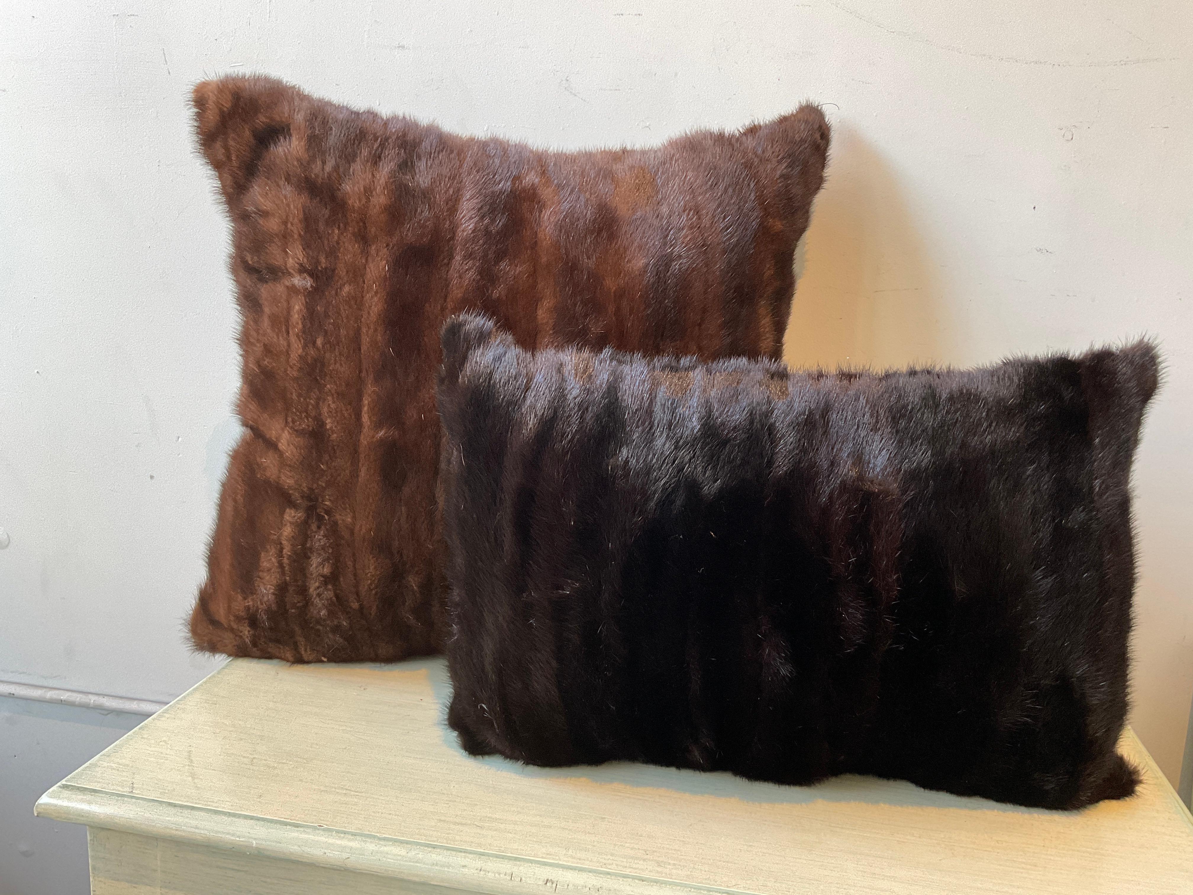 Mink pillow.  Pillows have a zipper . Down insert.Small pillow is H12 W19 D4.5
These pillows are priced separately. The price is per pillow.
Large pillow is marked 700, the small pillow is marked 500.