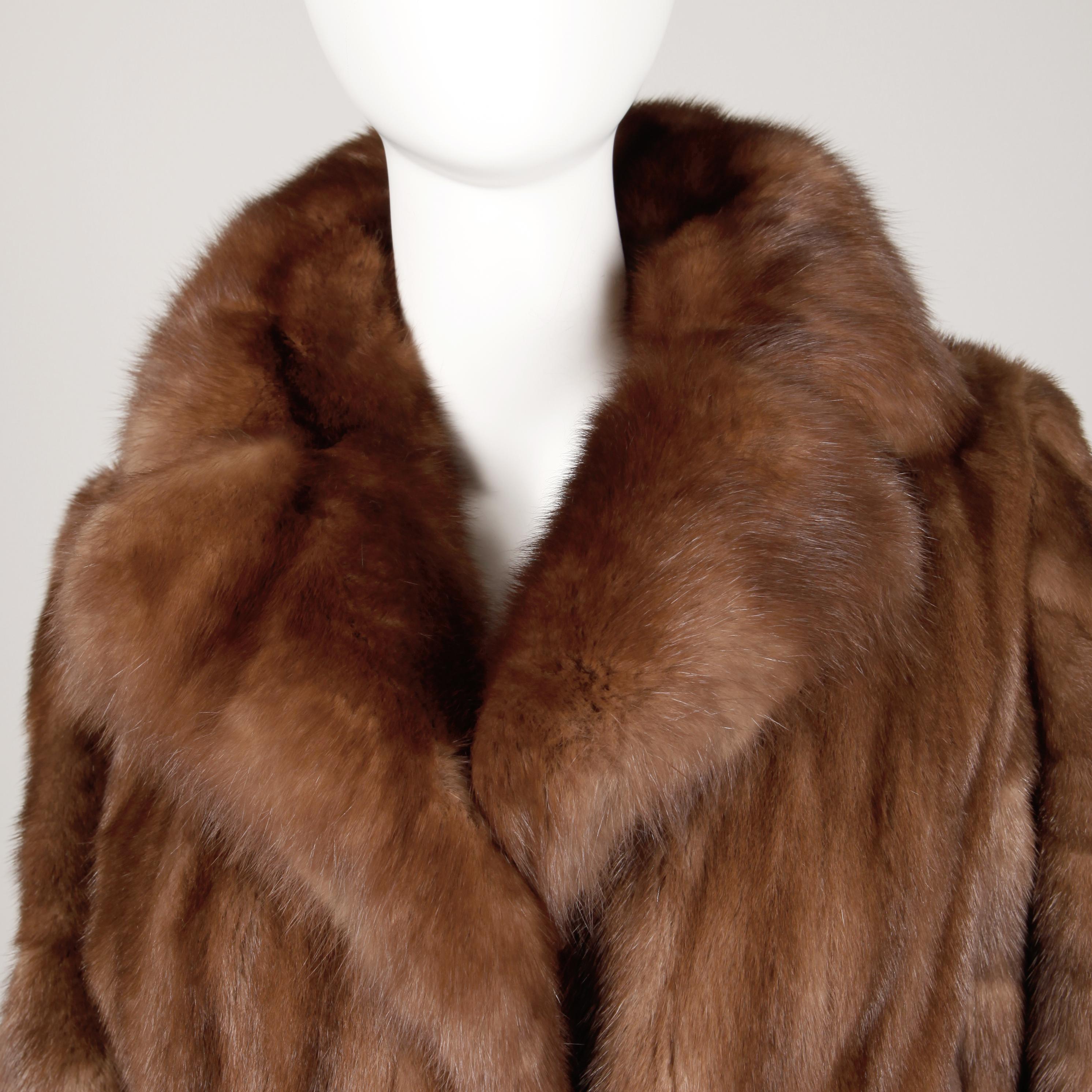 Stunning vintage demi buff mink fur coat with a plush sable fur collar from the estate of Pamela Lewis (Jerry Lewis, Gary Lewis). Light weight female mink pelts are beautifully matched. Diagonal flared sleeves and flared sweep. Fully lined with